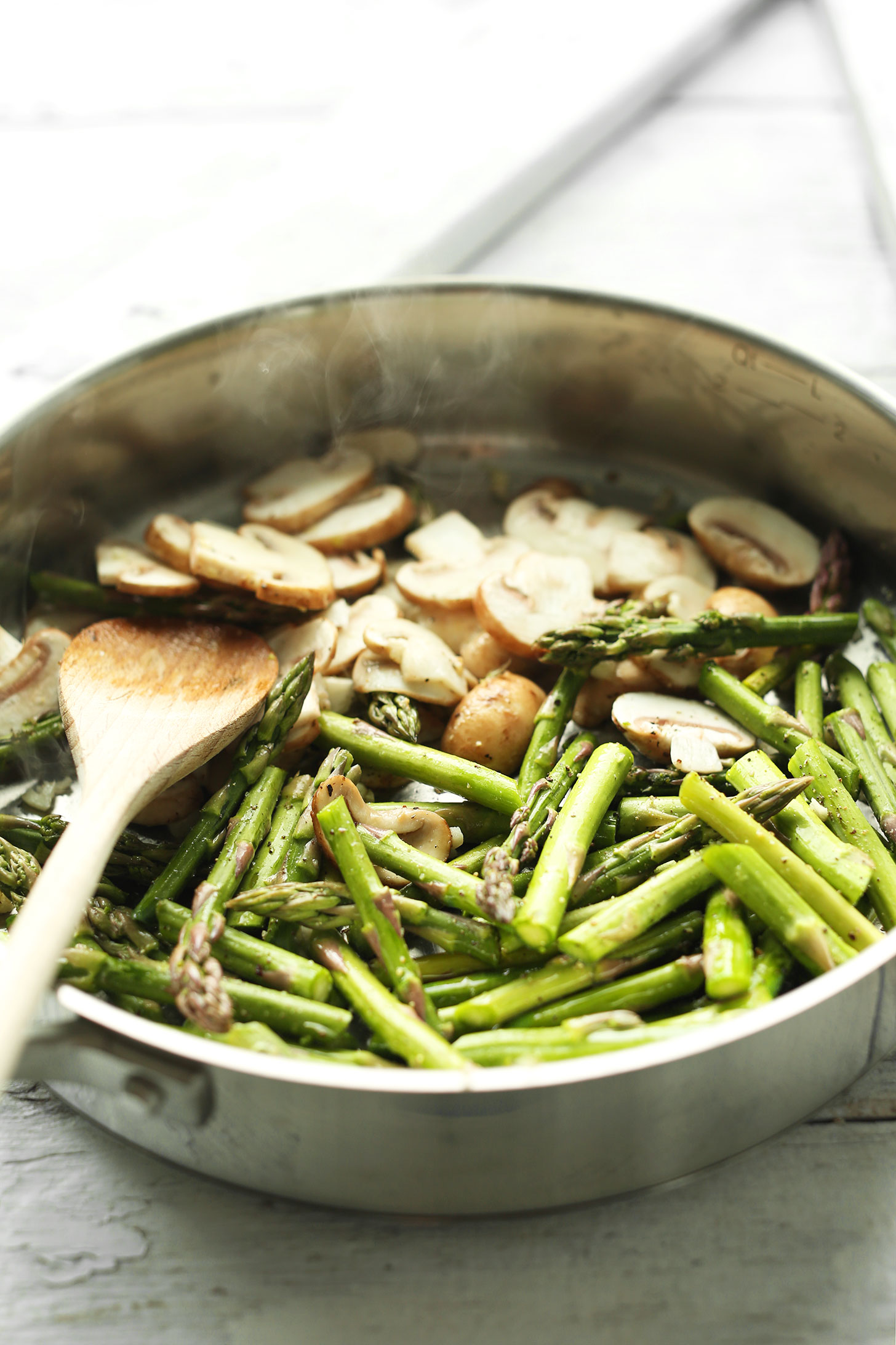 Sautéing mushrooms and asparagus for a simple plant-based meal