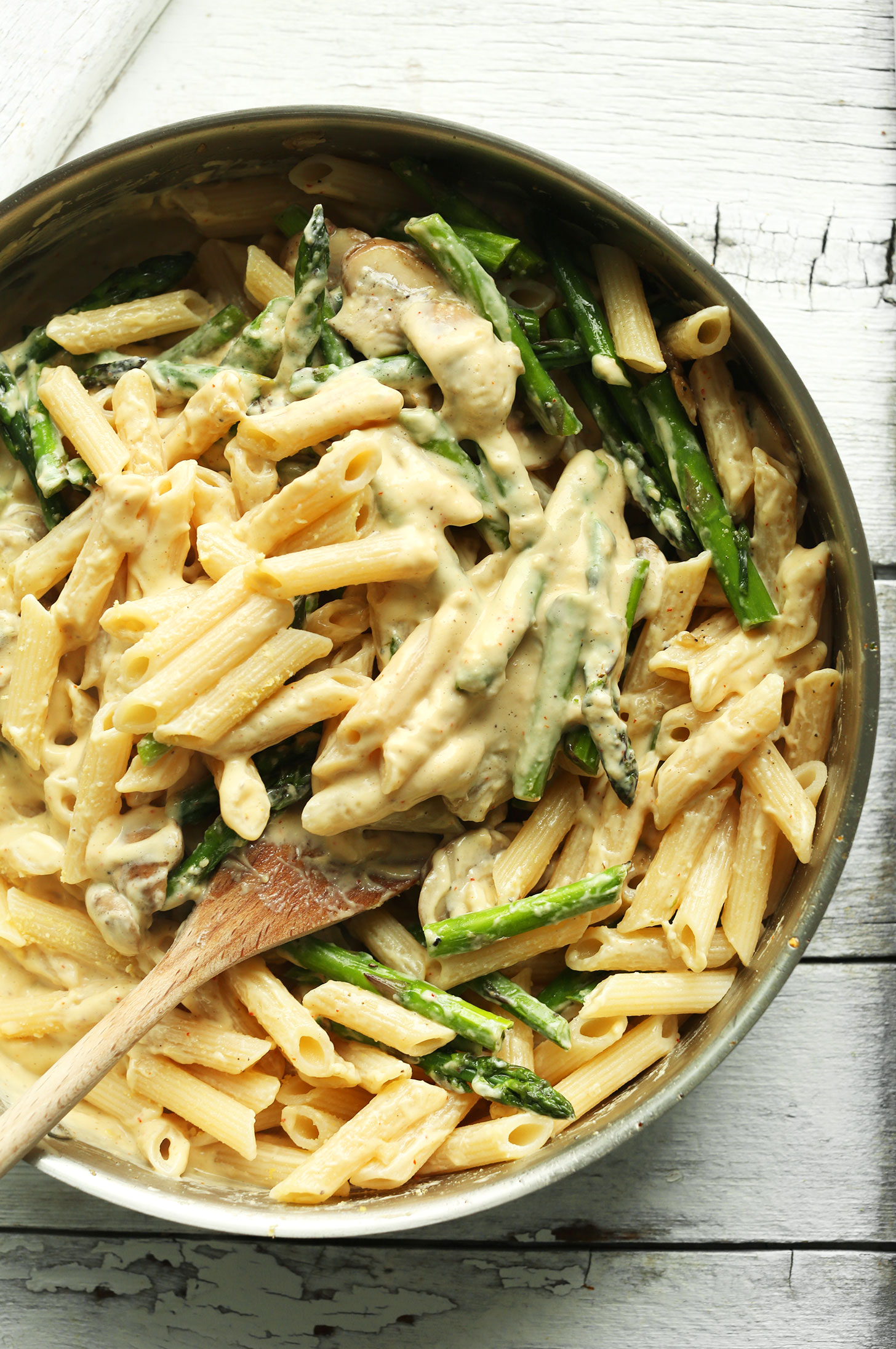 Using a wooden spoon to stir our Gluten-Free Vegan Pasta recipe