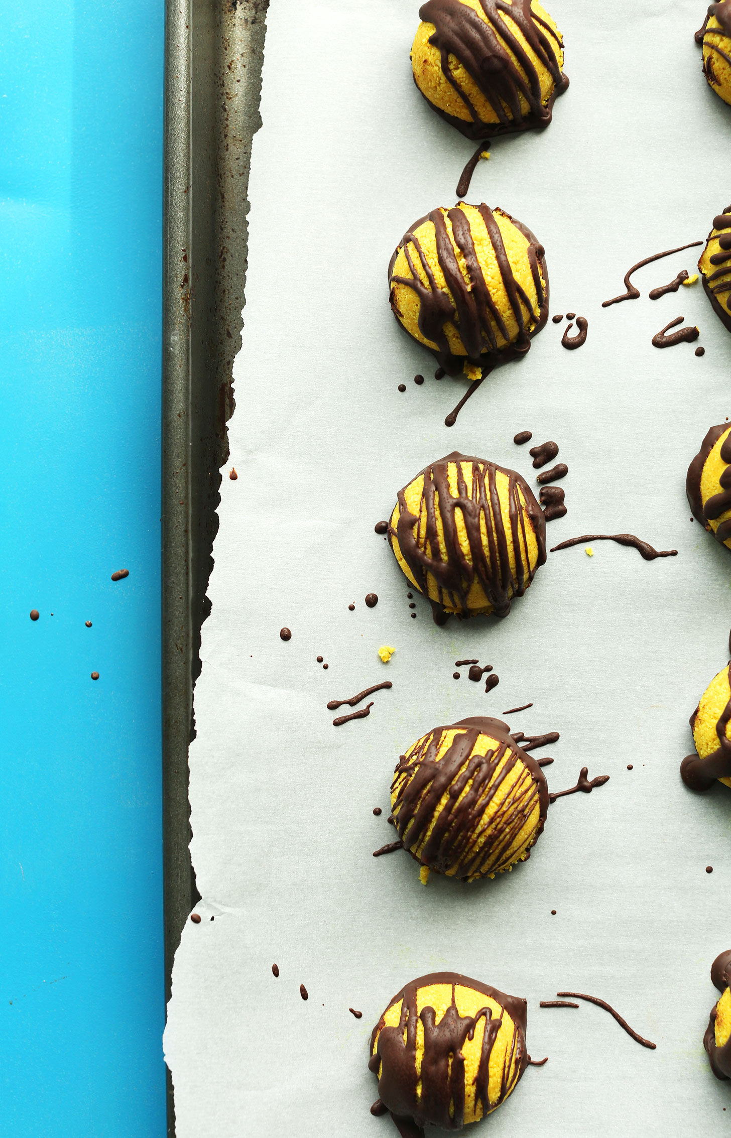 Healthy vegan gluten-free Golden Milk Macaroons drizzled with Dark Chocolate
