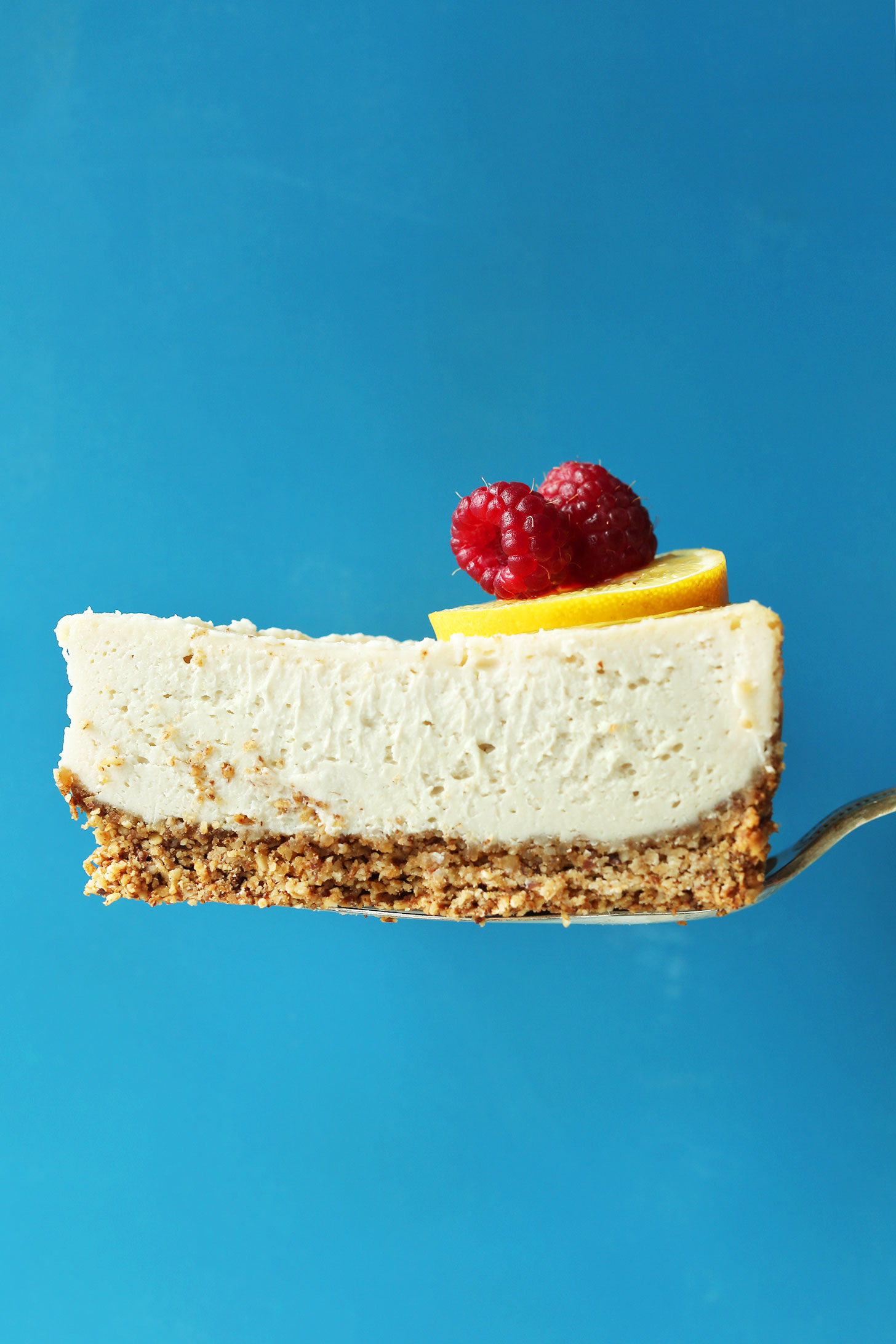 Slice of our easy vegan gluten-free baked cheesecake