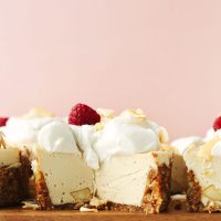 Cutting board filled with mini White Chocolate Macadamia Nut Cheesecakes