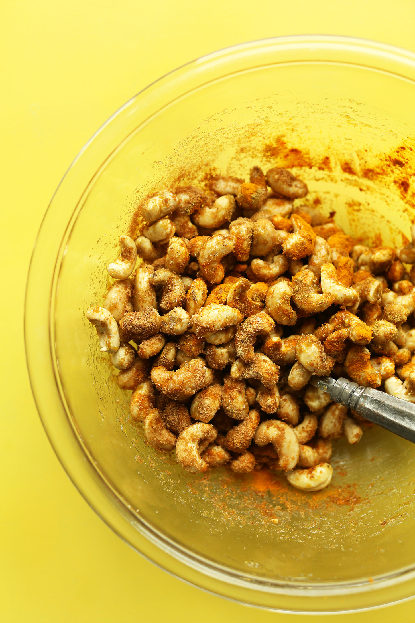 Stirring spices and cashews for making Curry-Spiced Cashews