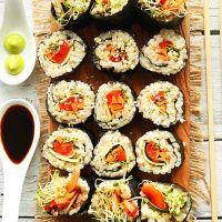 Cutting board filled with homemade Brown Rice Sushi