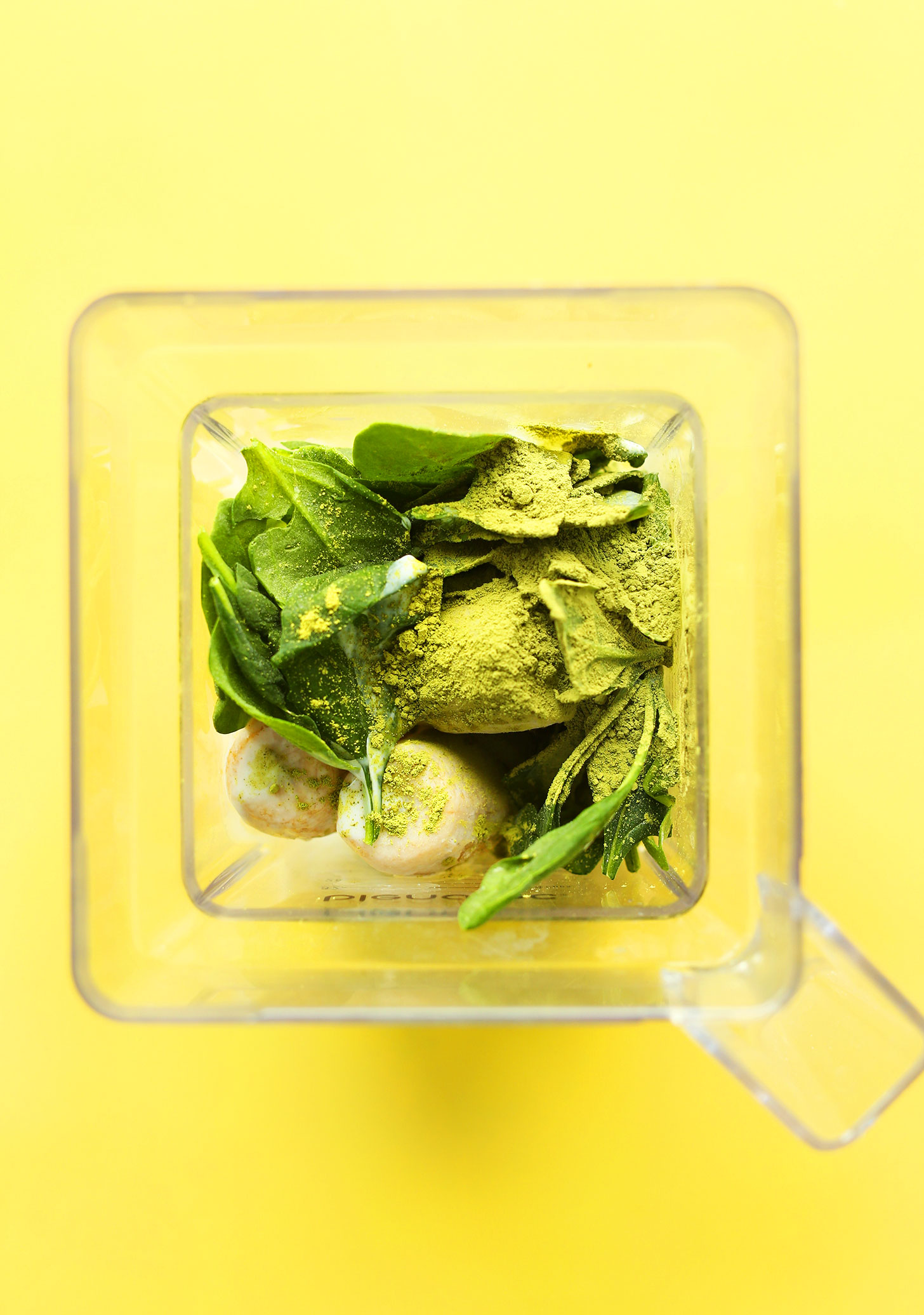 Blender with ingredients for making our refreshing Matcha Green Smoothie Bowl recipe