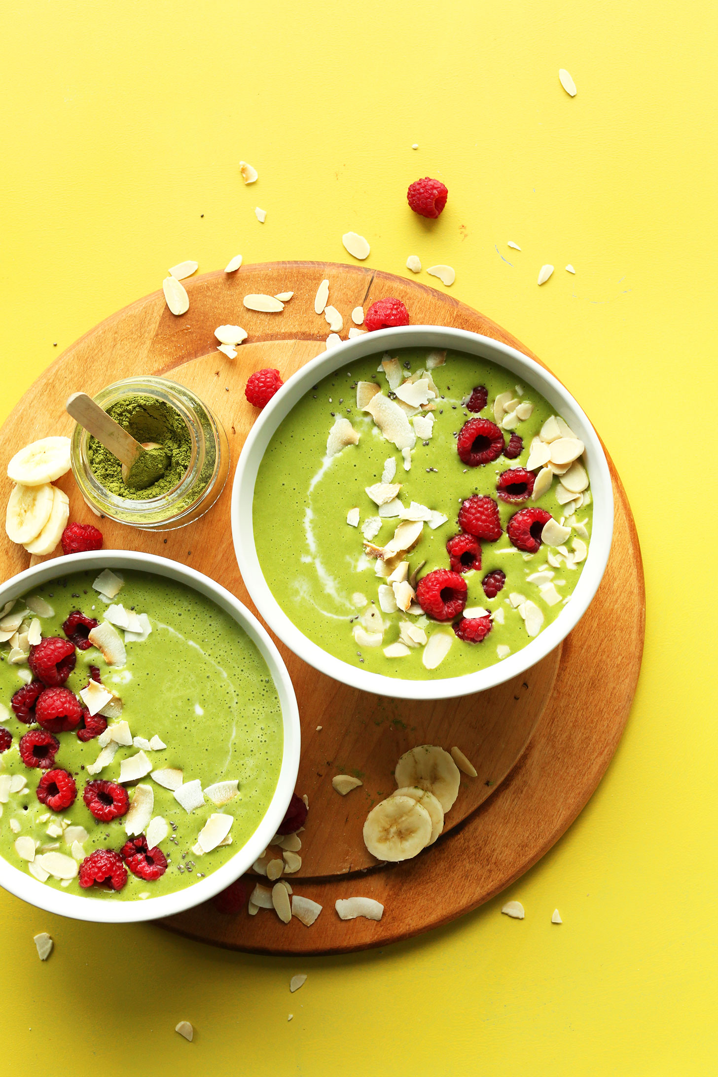 Two bowls filled with our gluten-free vegan Matcha Green Smoothie Bowl recipe