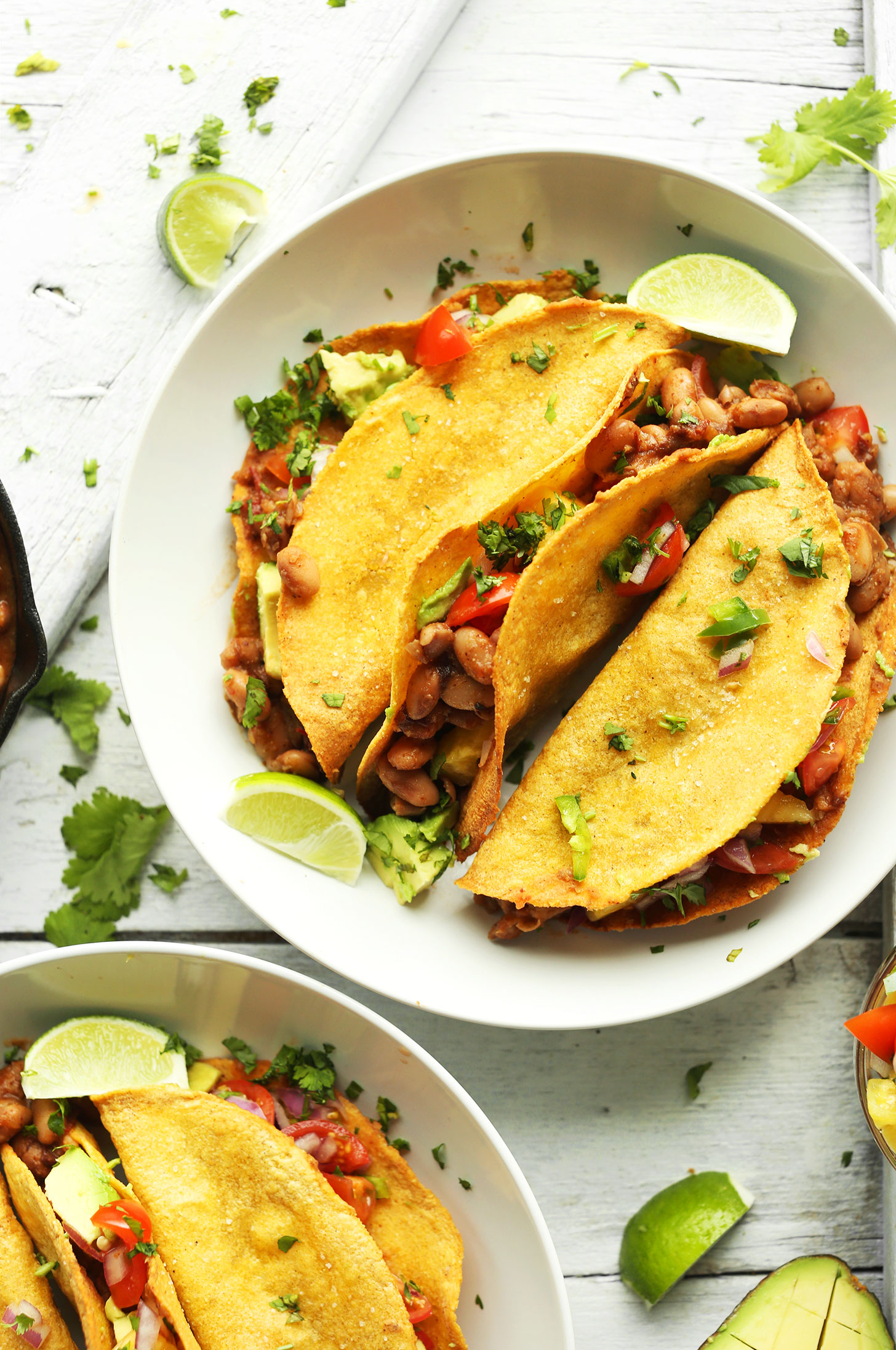 A plate of our Crispy Baked Tacos with Pinto Beans, Pineapple salsa, and Avocado