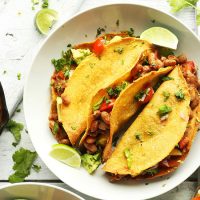 Bowl with three Crispy Baked Tacos topped with Pineapple Salsa