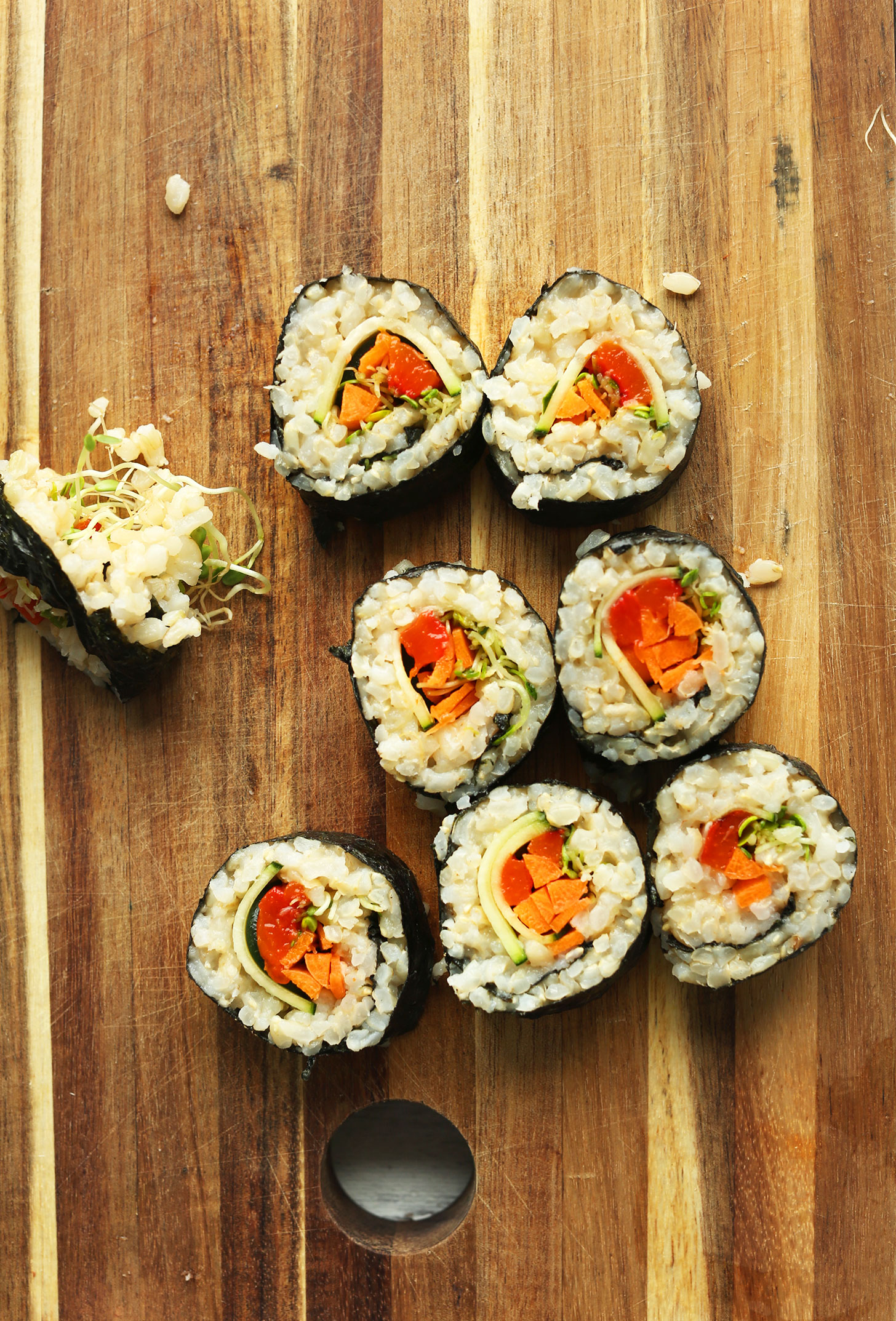 Rolls of homemade plant-based sushi on a cutting board