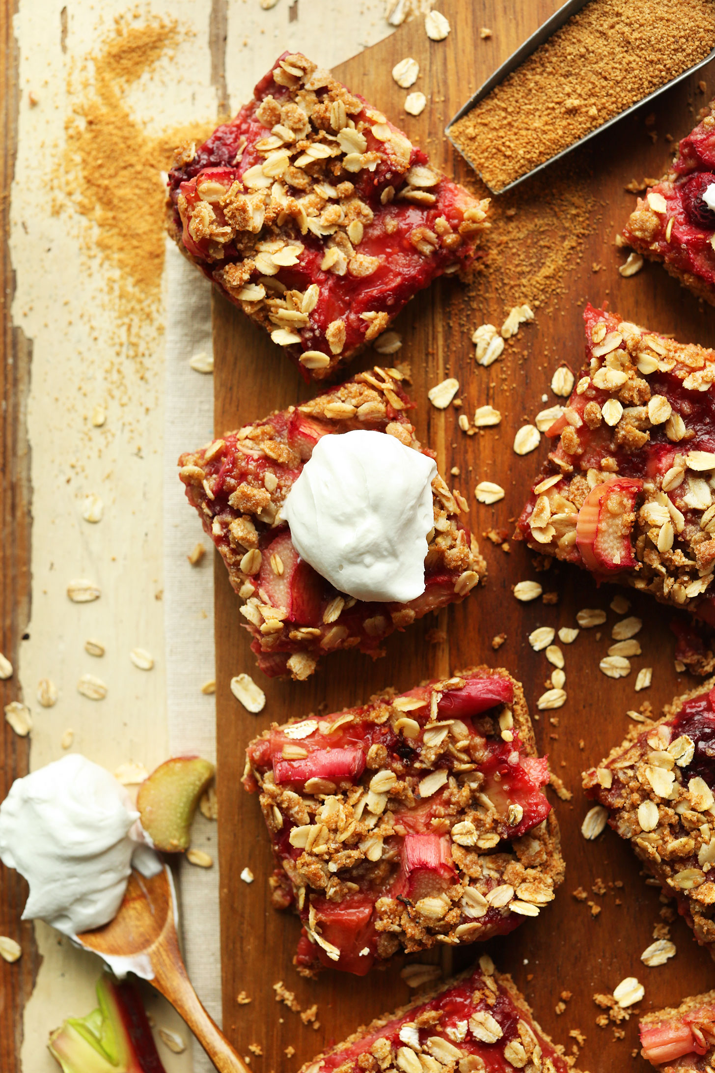 Squares of our delicious gluten-free vegan Strawberry Rhubarb Crumble Bars recipe