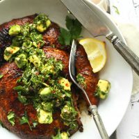Slicing into a Grilled Portobello Mushroom Burger for a gluten-free vegan summer dinner