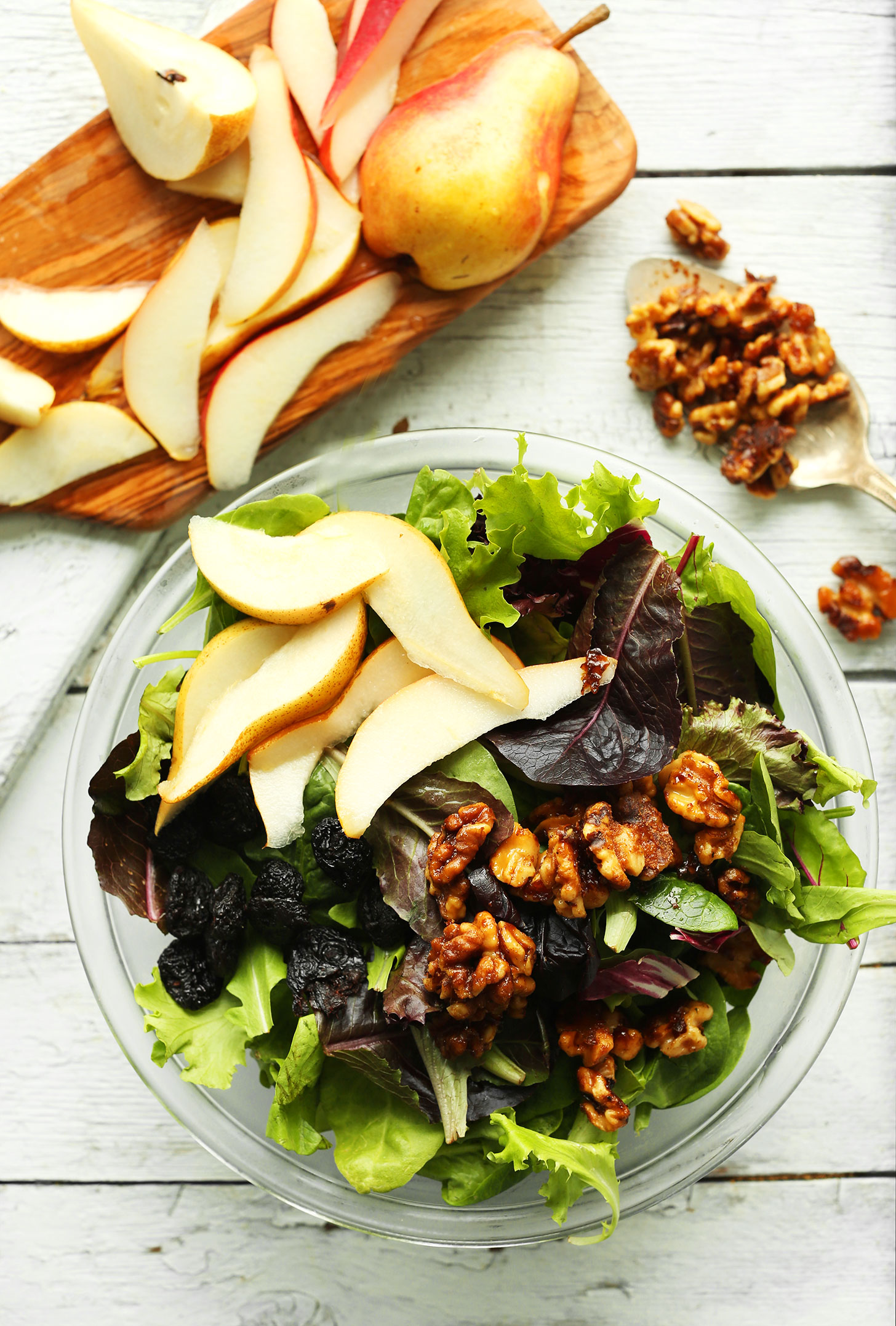 Bowl of our gluten-free vegan Pear Salad with Dried Cherries and Candied Walnuts