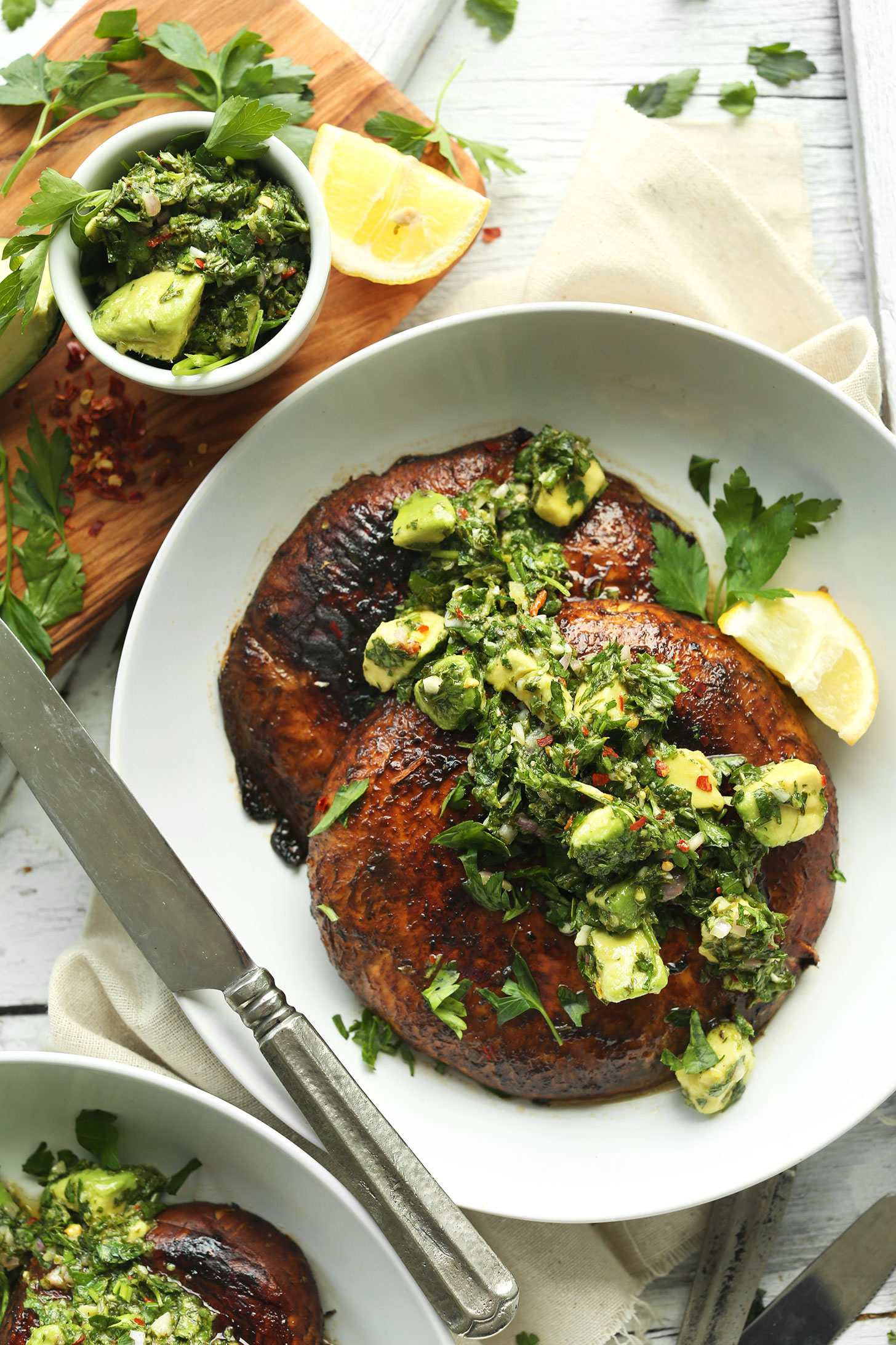 Bowl with Grilled Portobello Steaks topped with Avocado Chimichurri for a vegan grill recipe