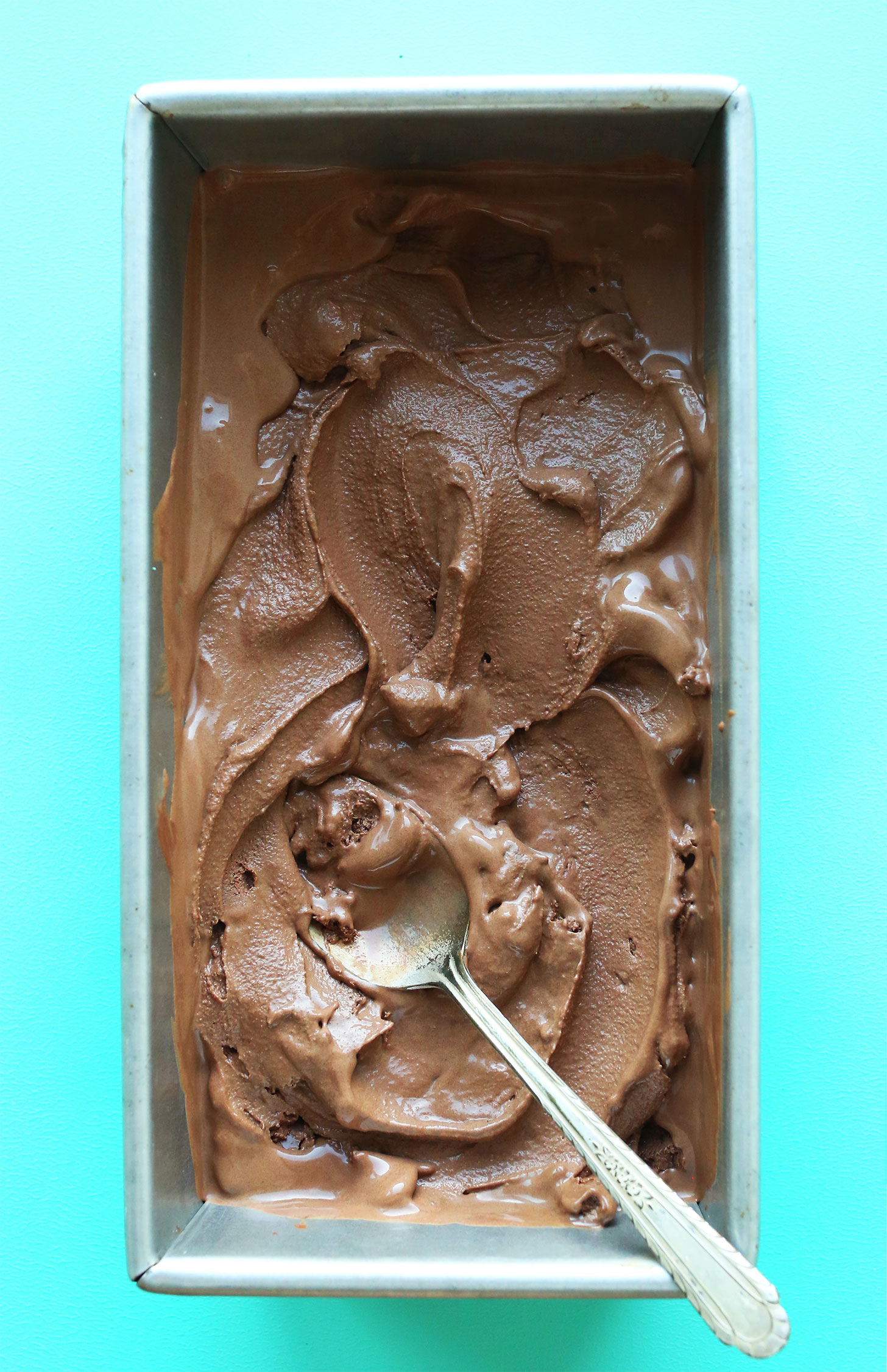Metal bread pan filled with homemade vegan chocolate ice cream