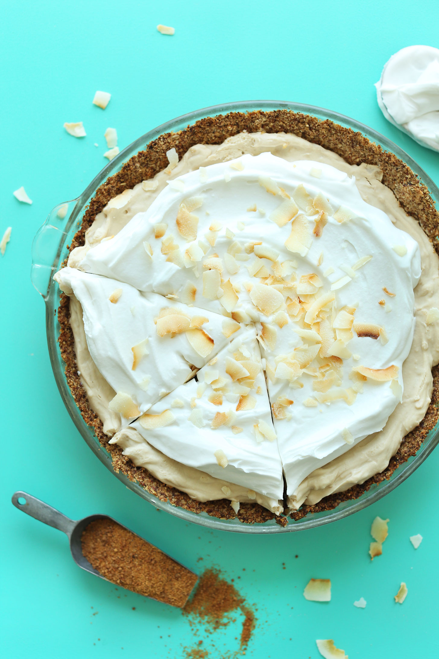 Partially sliced gluten-free vegan Coconut Cream PIe