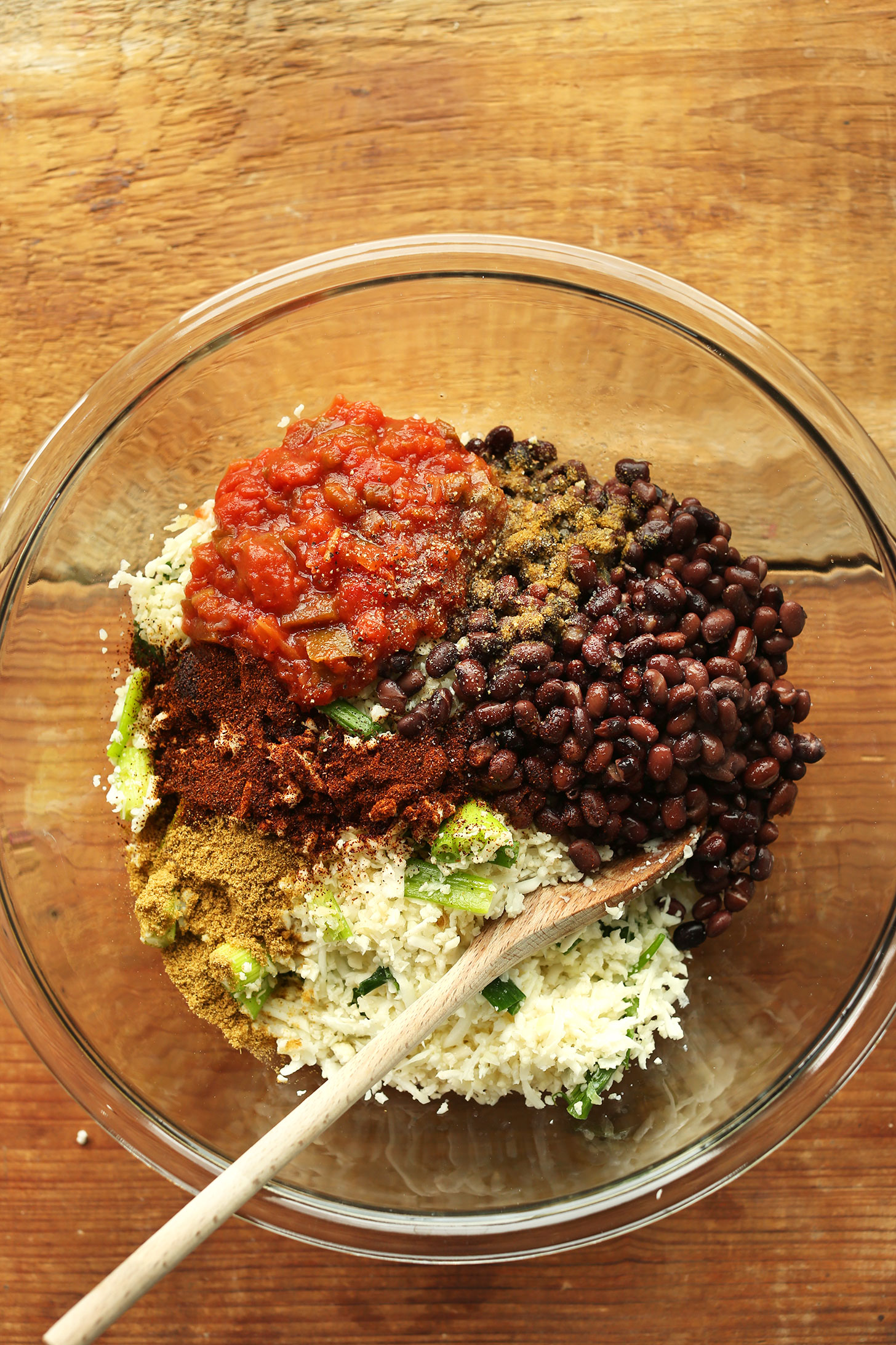 Stirring together filling ingredients for protein and fiber rich vegan Stuffed Peppers