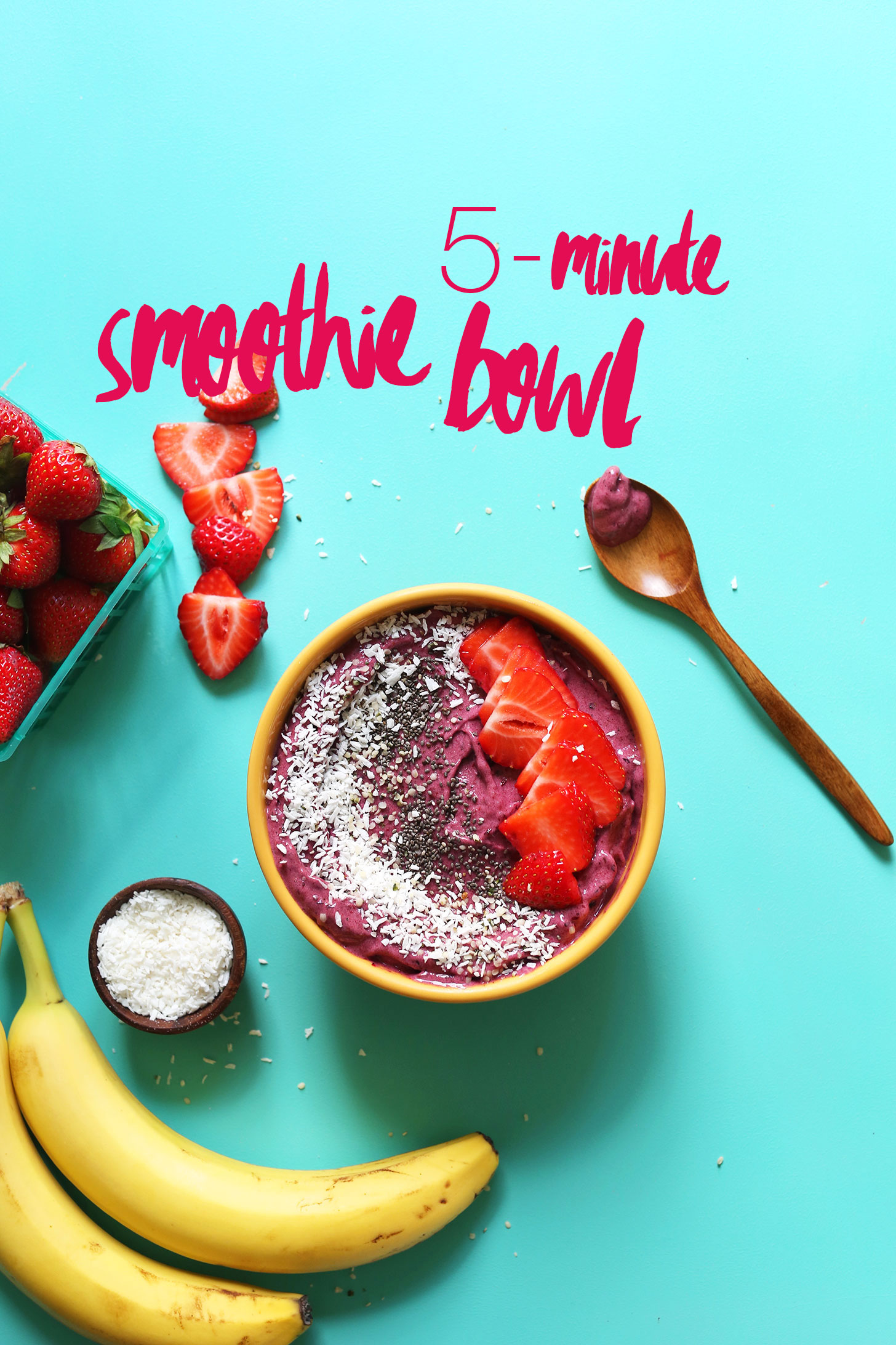 Naturally-sweetened vegan Smoothie Bowl topped with coconut, chia seeds, and strawberries