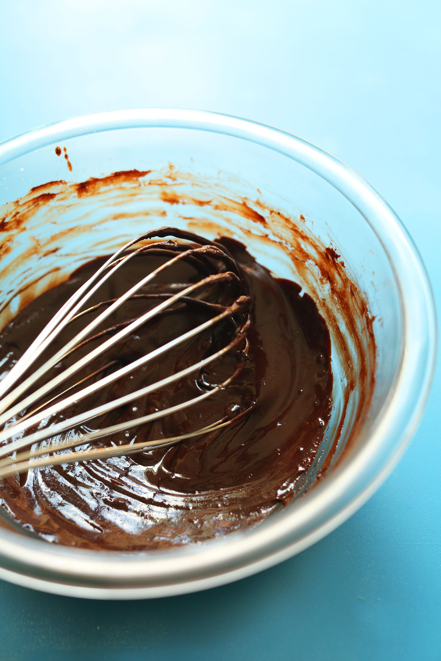 Whisking homemade vegan chocolate sauce for a delicious vegan dessert recipe