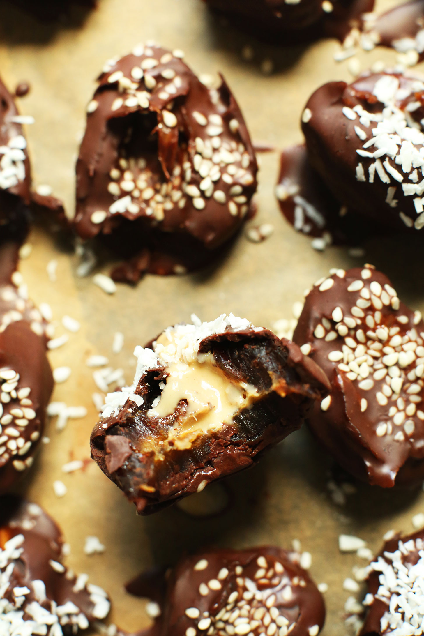 Parchment-lined baking sheet with Tahini-Stuffed Dates for a gluten-free vegan snack
