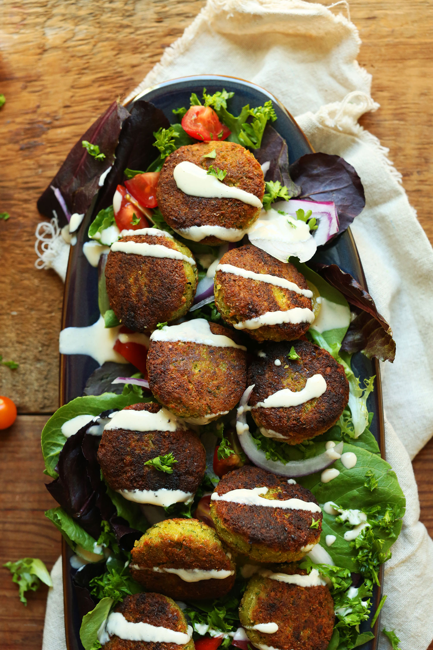 Platter with mixed greens topped with our 10-ingredient Classic Vegan Falafel recipe