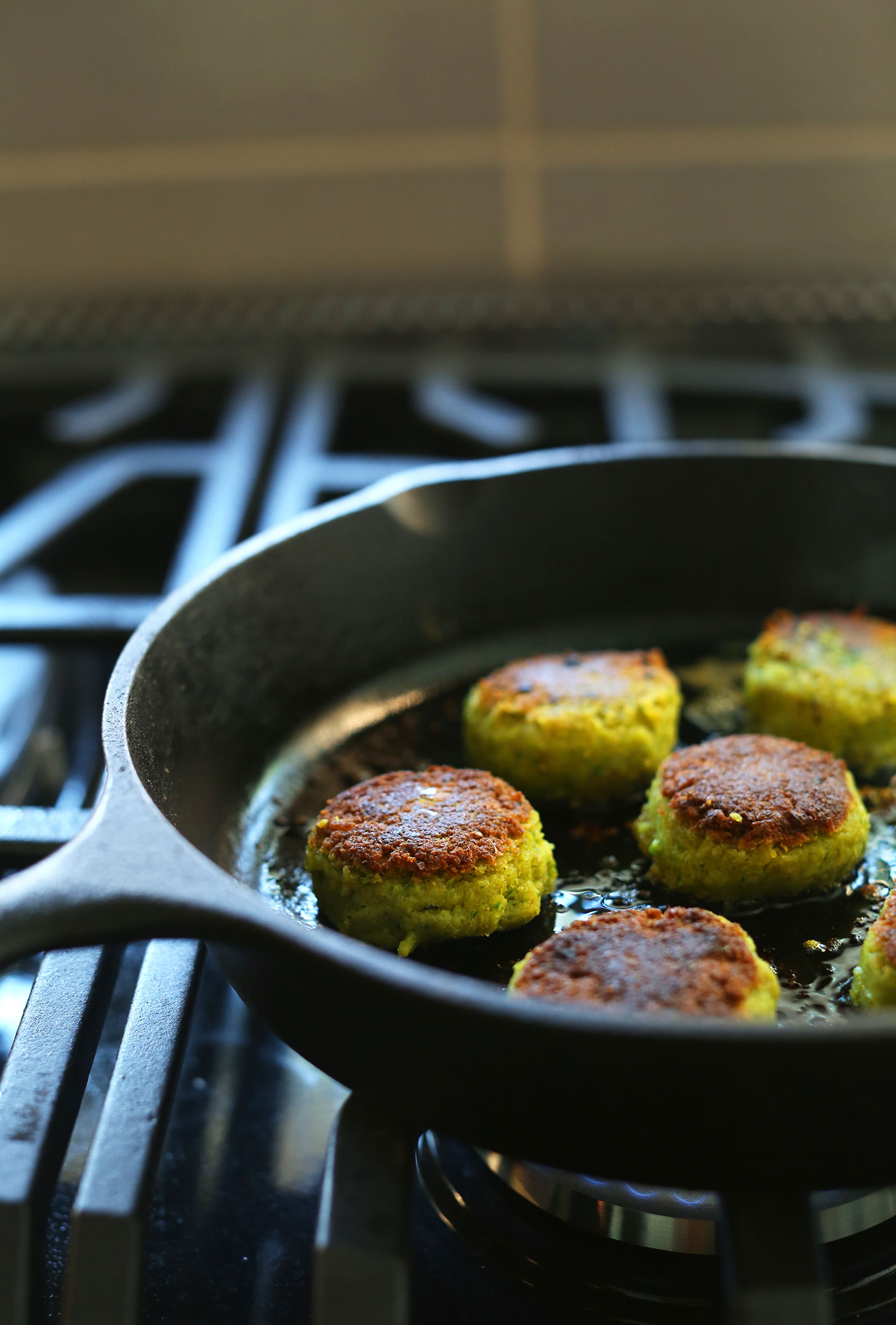 Cooking vegan falafel in a cast-iron skillet for Mediterranean Bowls
