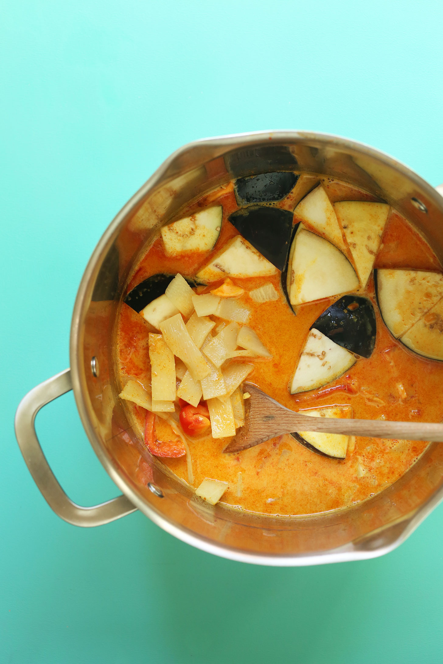 Stirring ingredients for our 1-Pot Vegetable Coconut Red Chickpea Curry recipe