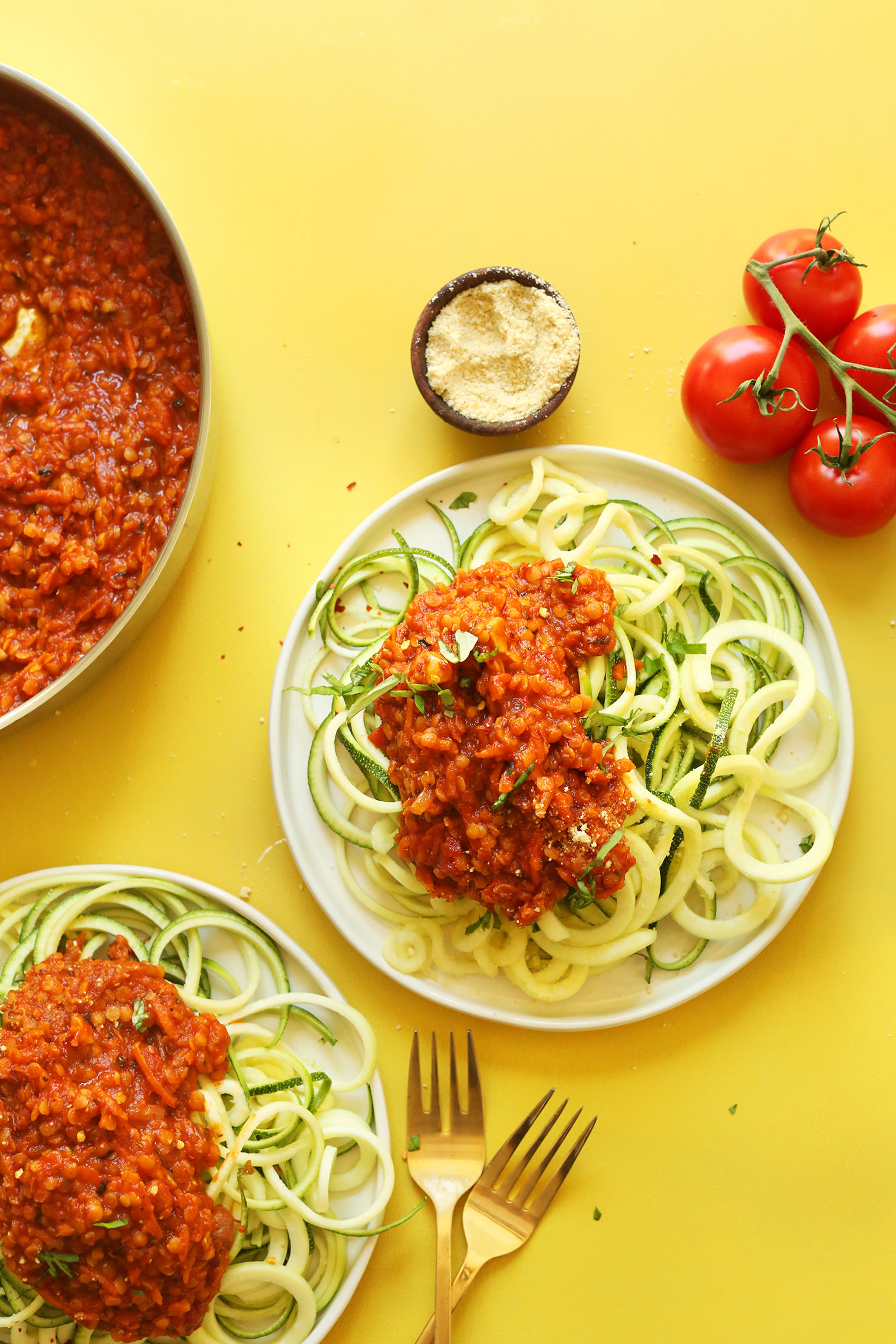 Plates of zucchini pasta with lentil pasta sauce