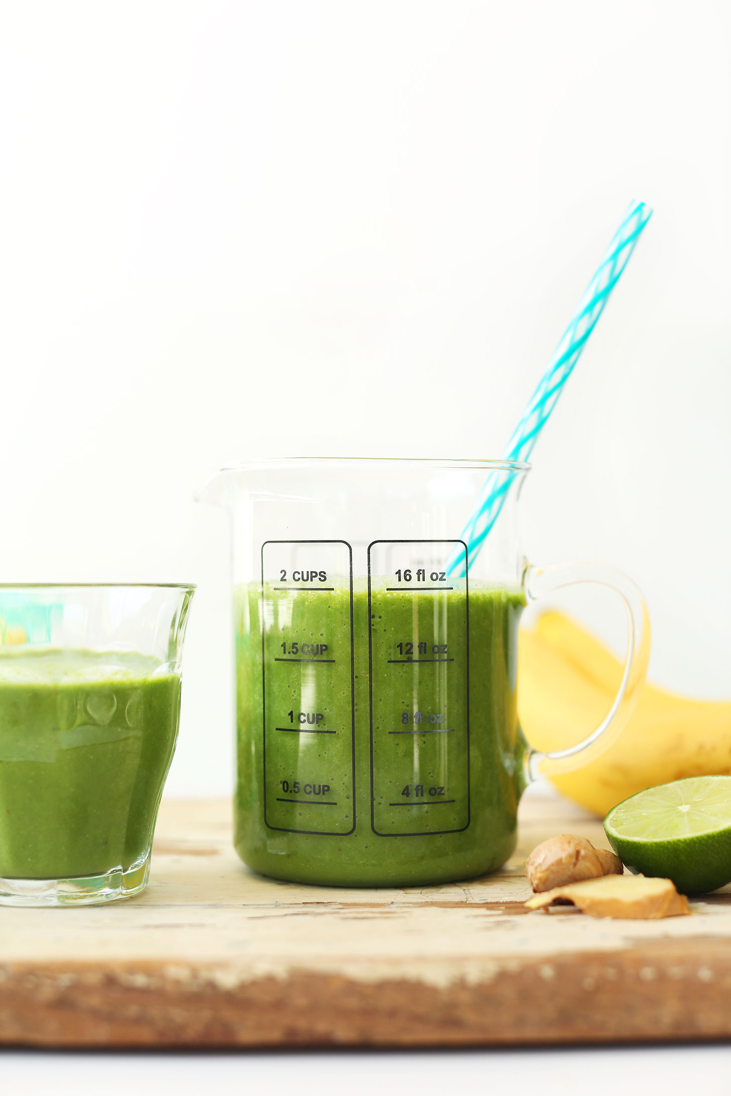 Measuring and serving glass with our Ginger Colada Green Smoothie recipe