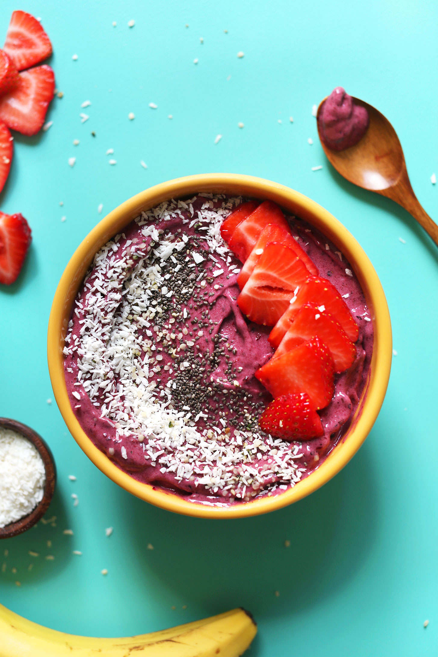 The perfect gluten-free vegan 5-Minute Smoothie Bowl topped with shredded coconut, chia seeds, and strawberries