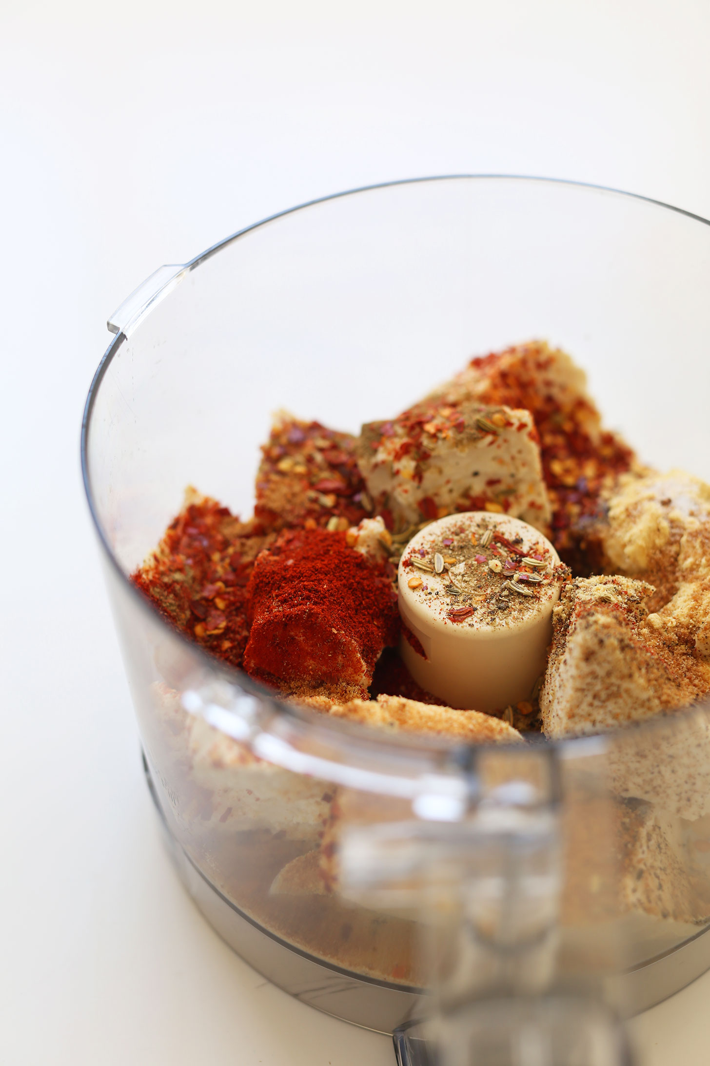 Food processor with ingredients for making our easy, delicious gluten-free vegan pepperoni recipe