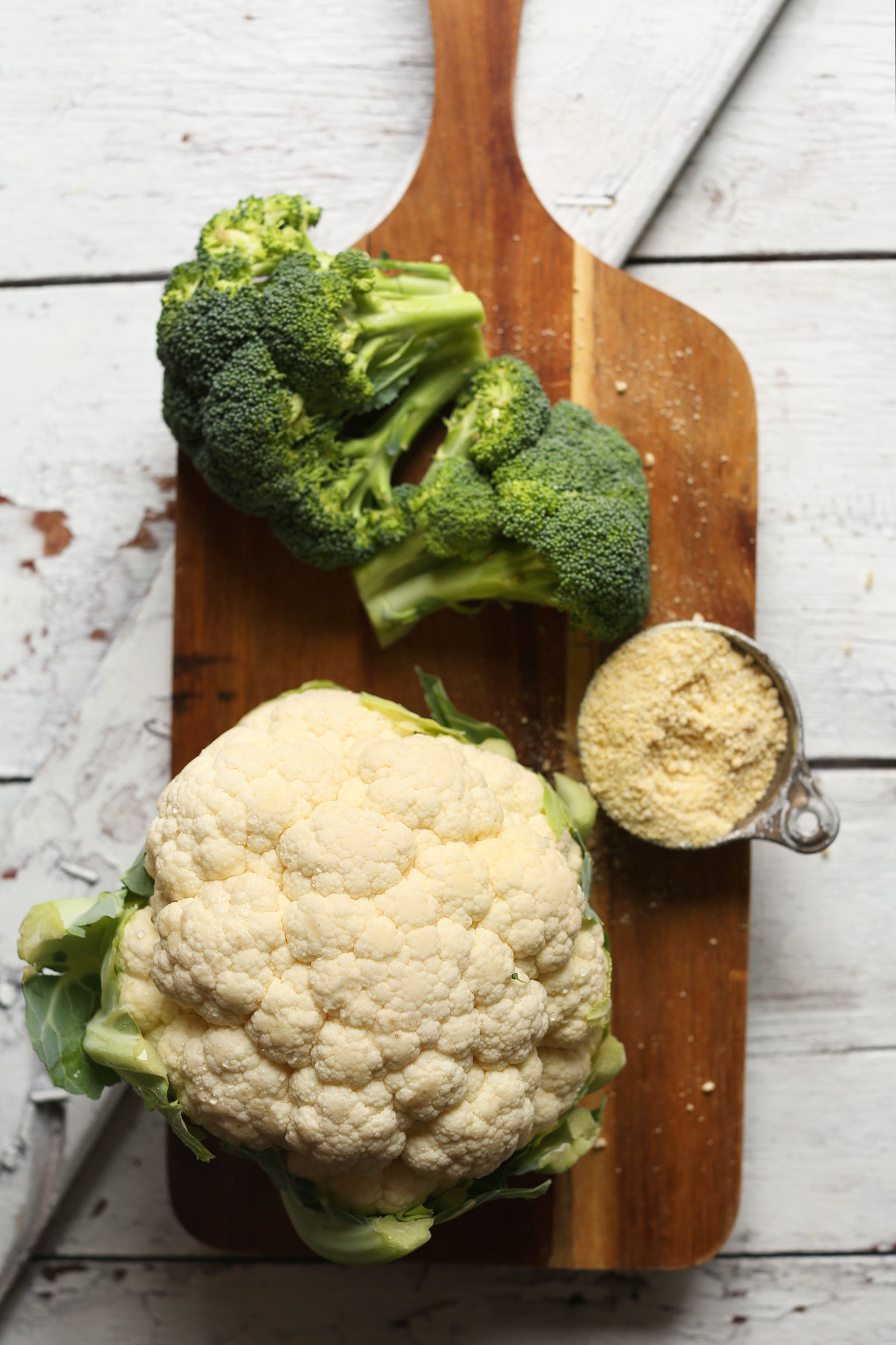 Broccoli, cauliflower, and vegan parmesan cheese for making healthy vegan comfort food