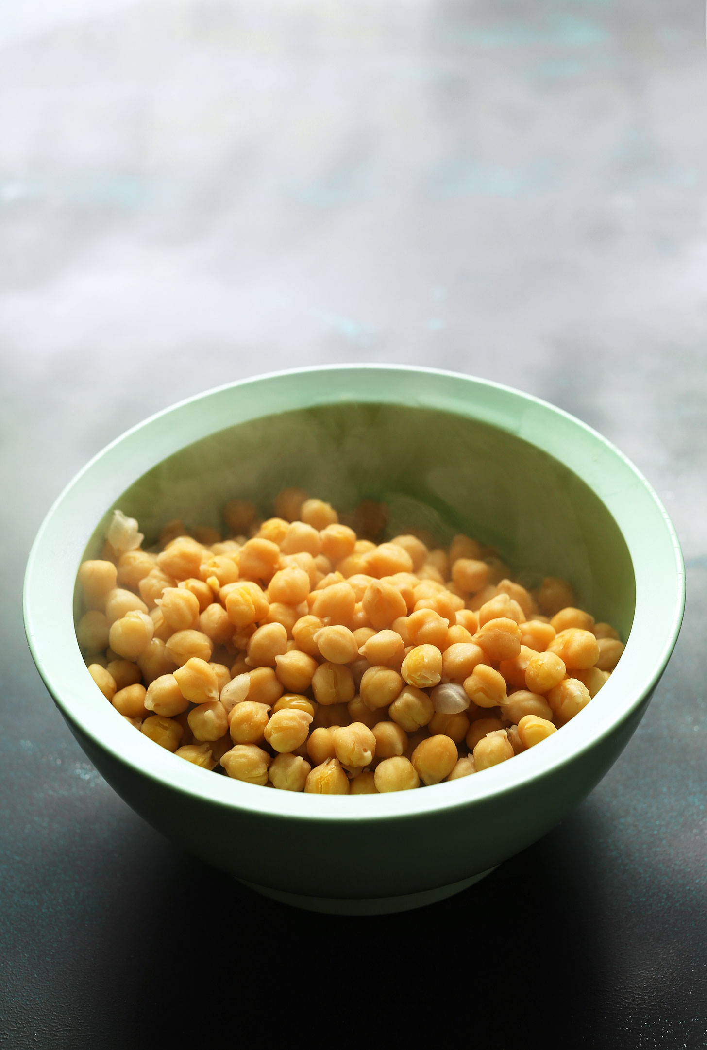 Bowl of warm chickpeas for making our Healthy Quinoa Chickpea Buddha Bowls recipe