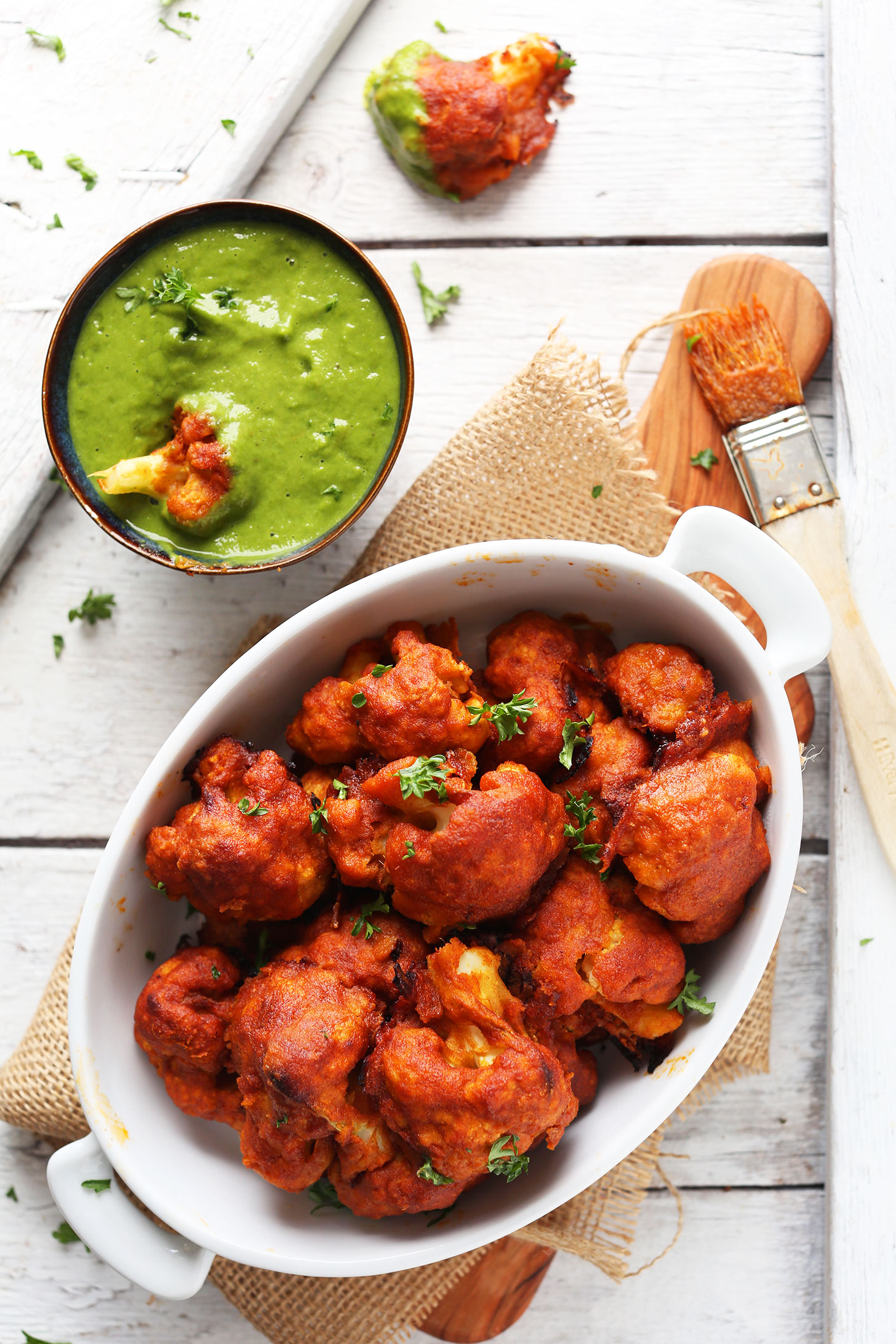 Bowl of Red Curry Cauliflower with Green Chutney for a vegan Indian recipe