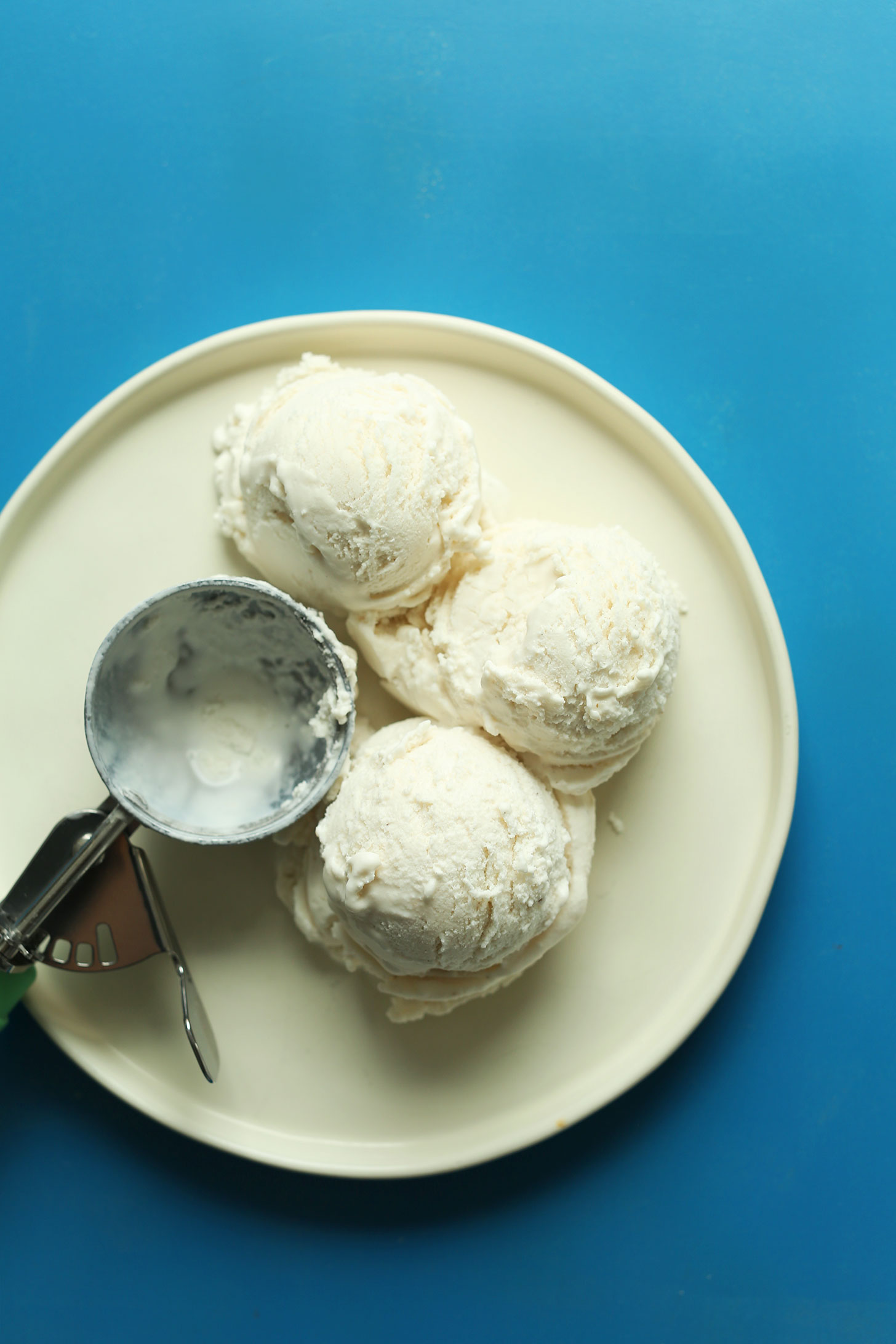 Three scoops of vegan vanilla coconut ice cream for making our Chocolate Malt Shake