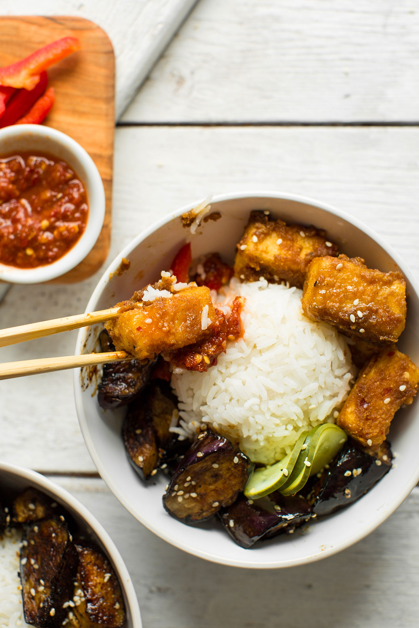 A bowl filled with our recipe for Sesame Eggplant & Almond Butter Tofu for a delicious plant-based meal