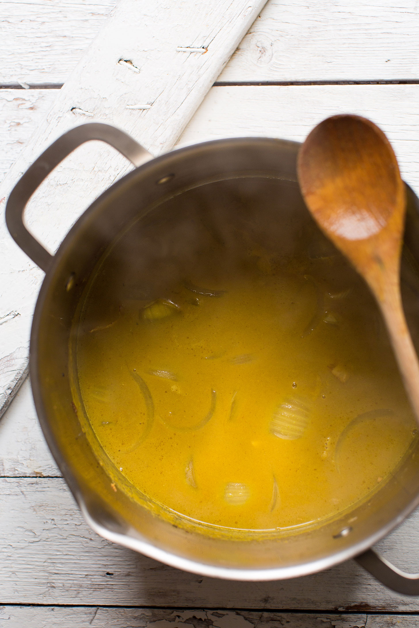 Big pot with broth for delicious vegan Coconut Curry Ramen