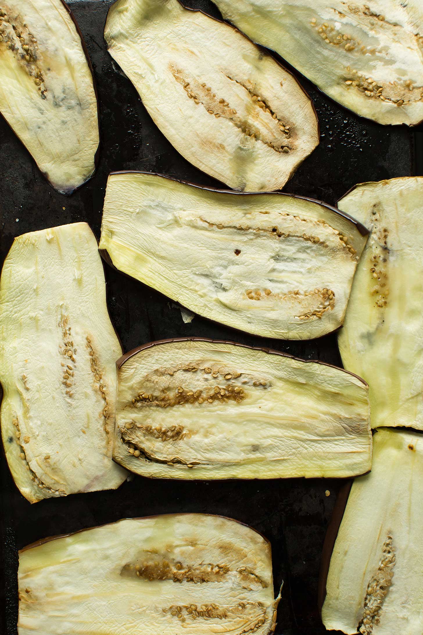 Baking sheet with thinly sliced eggplant for making easy gluten-free vegan lasagna