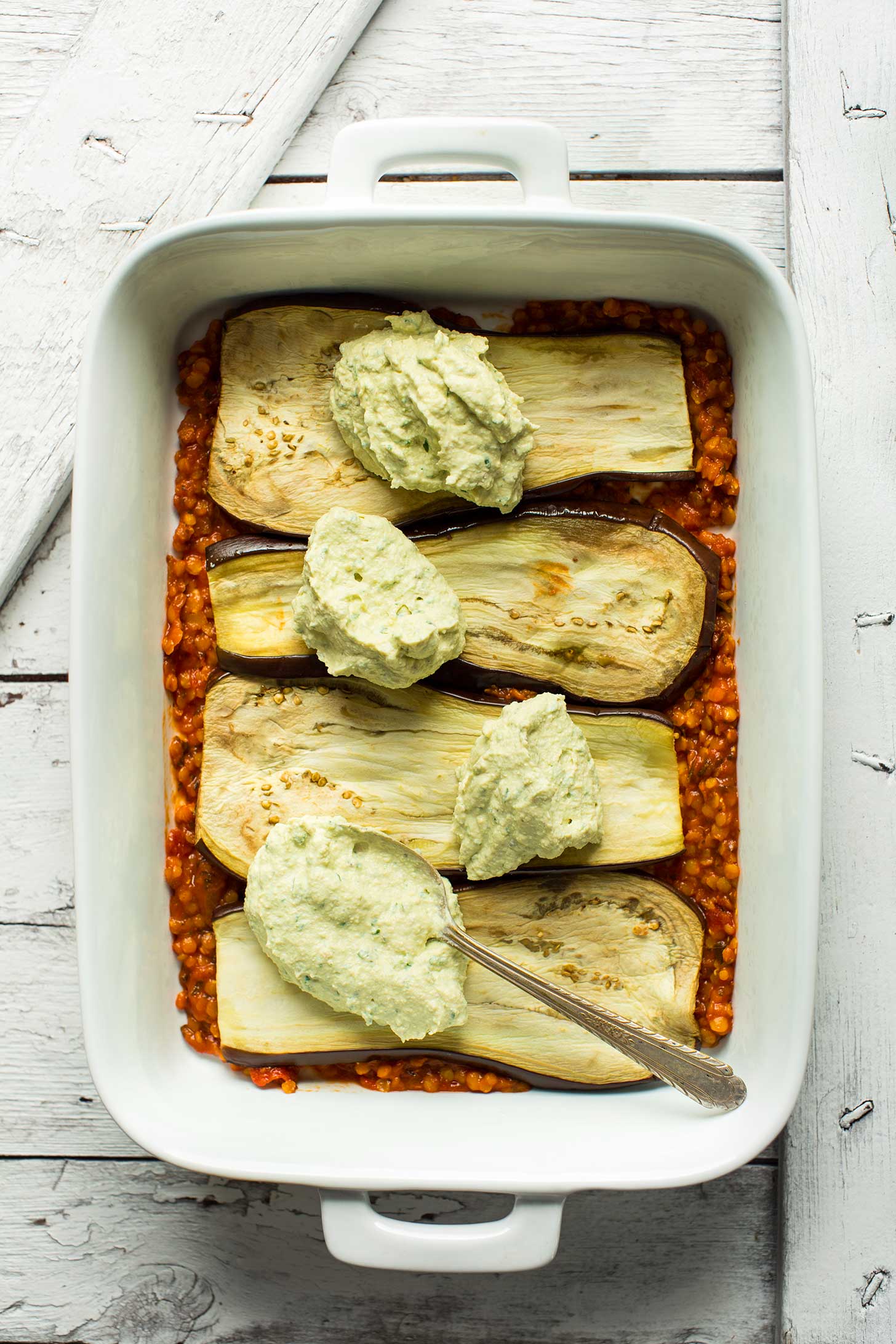 Adding a layer of vegan cheese over eggplant for hearty gluten-free vegan eggplant lasagna
