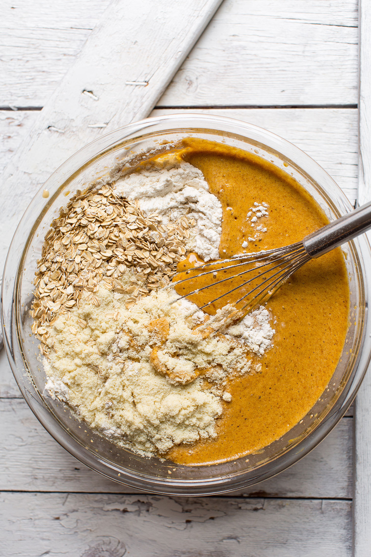 Whisking dry ingredients into wet for our gluten-free vegan Pumpkin Cake recipe
