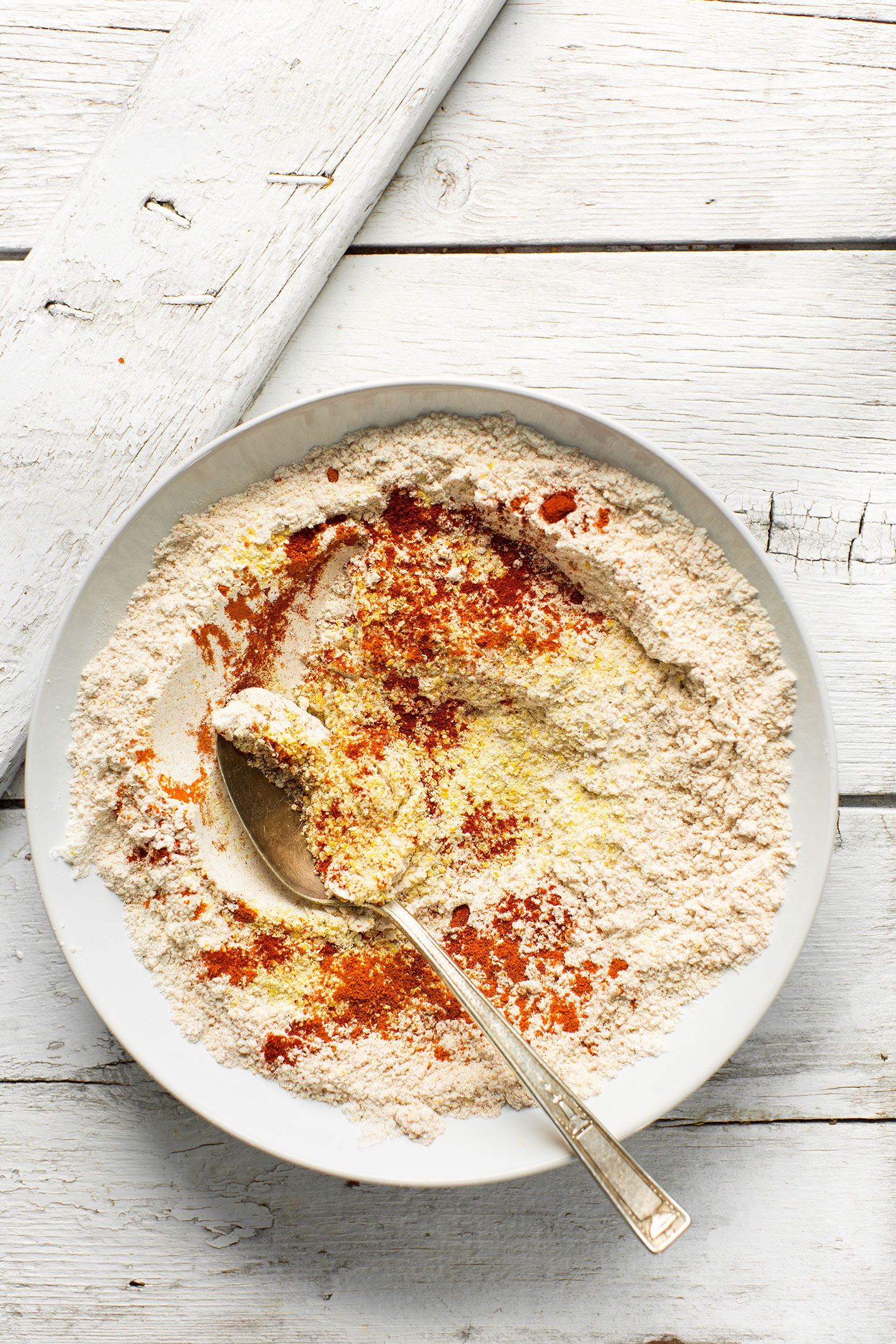 Stirring together the flour mixture for our gluten-free vegan onions rings recipe