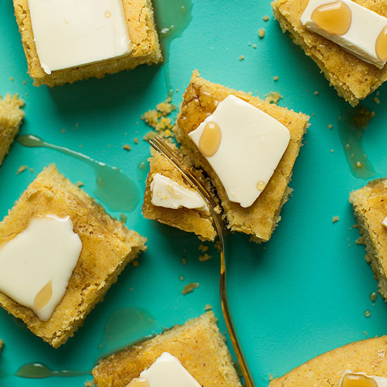 Using a fork to cut a corner off of a slice of Vegan Gluten-Free Cornbread
