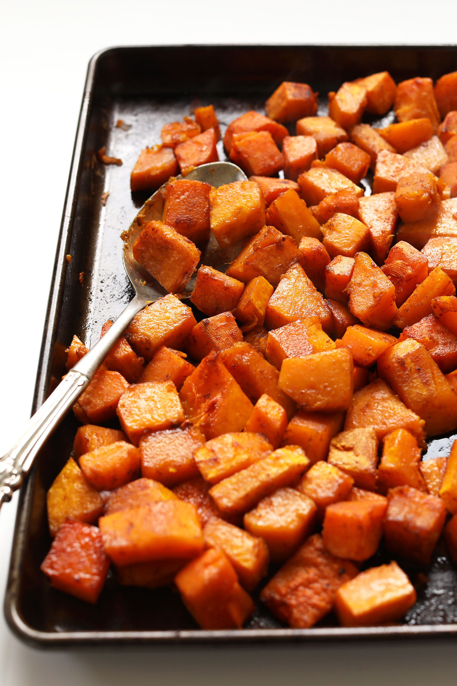 Baking sheet with freshly roasted Sweet Spicy Butternut Squash for a thanksgiving salad recipe