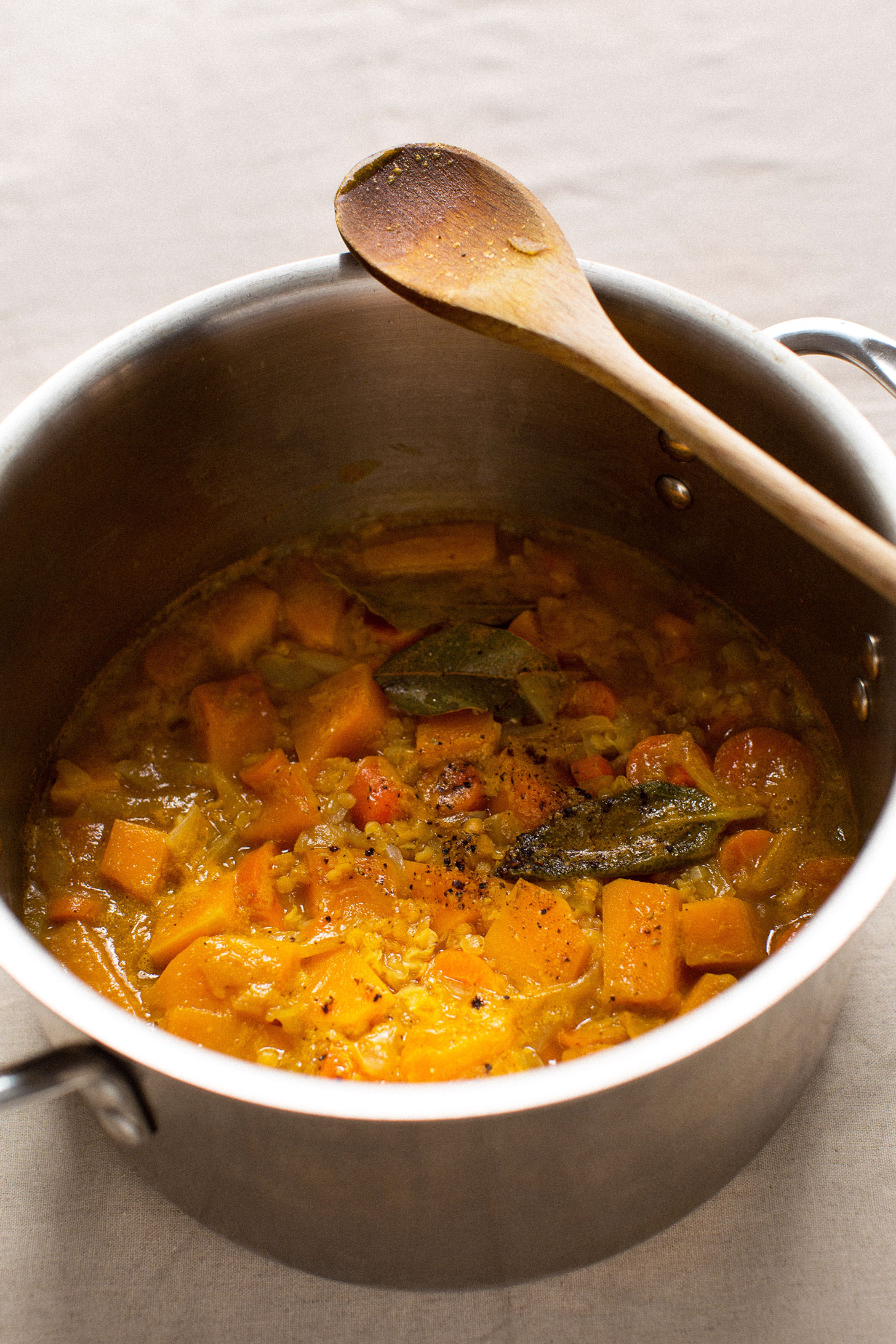 Cooked squash and vegetables ready to be pureed into Acorn Squash Soup