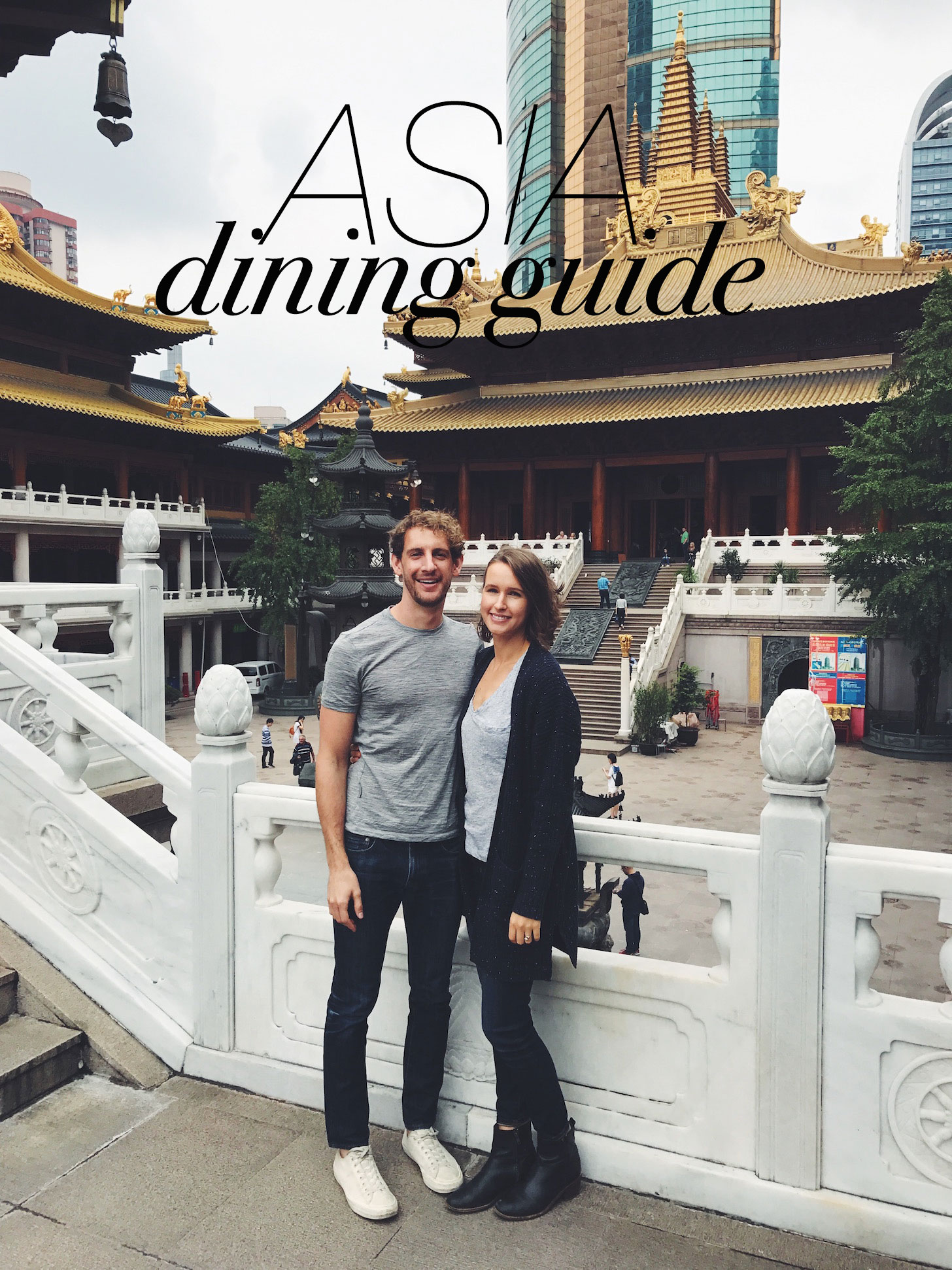 Photo of John and Dana in front of a template for our Asia Dining Guide