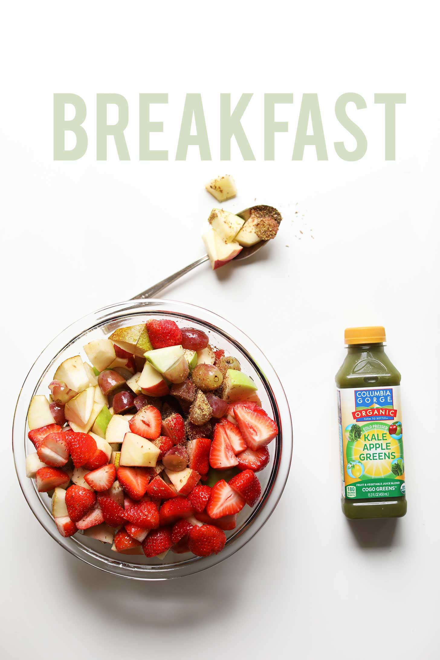 Bowl of fruit and green juice eaten on the Woman Code Cleanse
