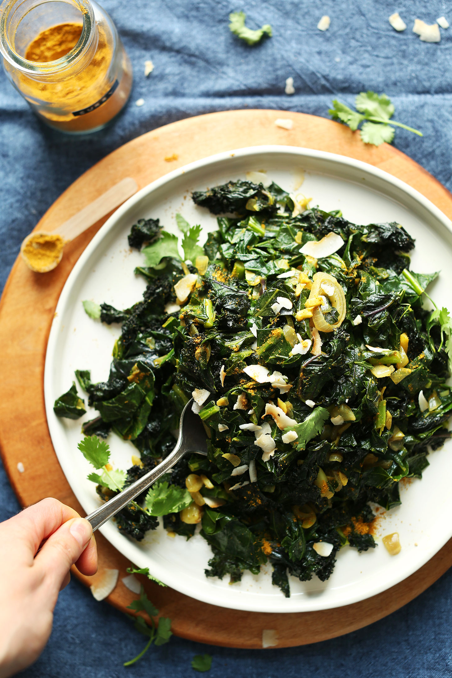 Grabbing a spoonful of our amazing Coconut Curried Greens recipe