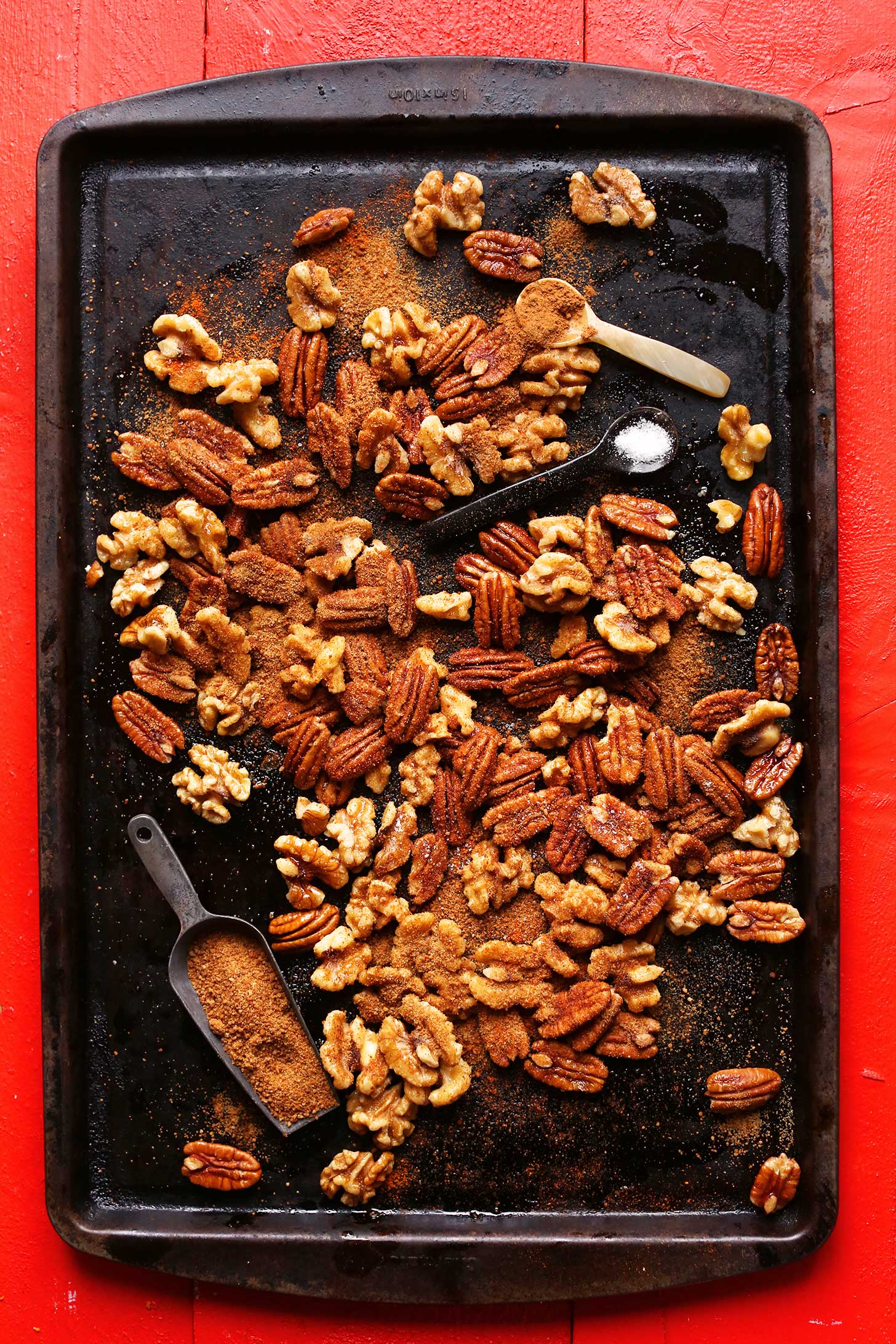Baking sheet with walnuts and pecans for making holiday spiced nuts