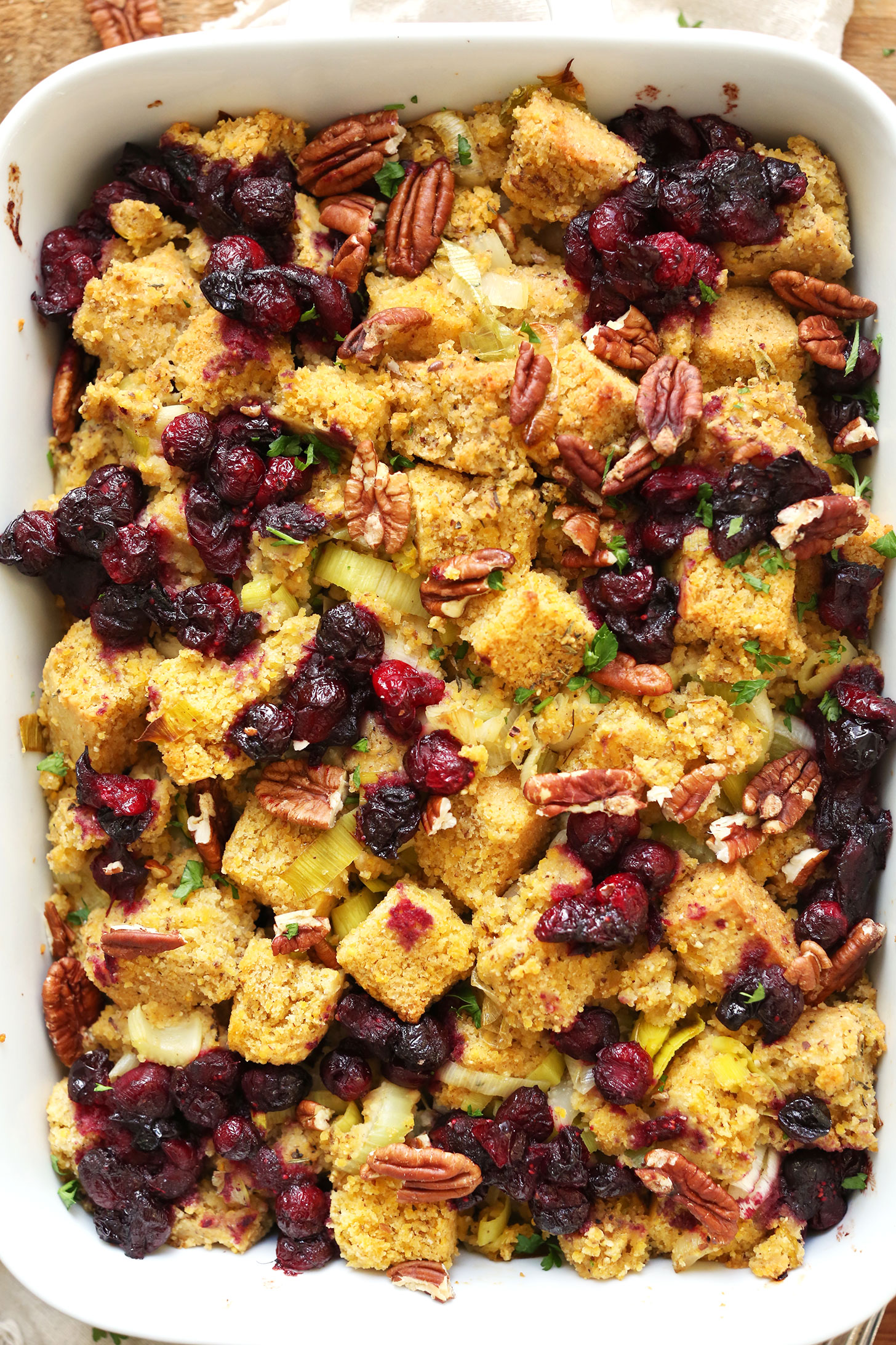 Ceramic baking dish with flavorful savory vegan gluten-free cornbread stuffing