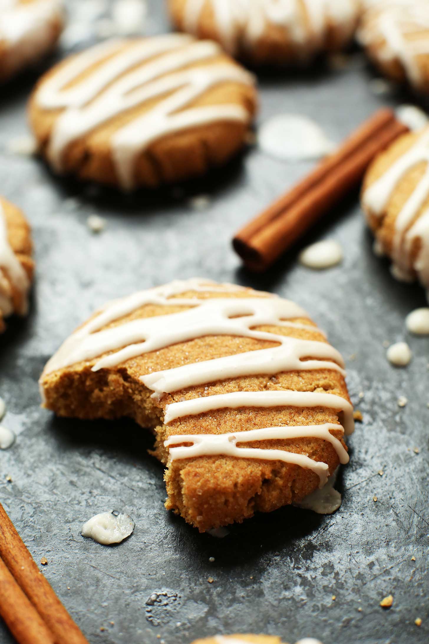 Half eaten Spicy Vegan GF Ginger Cookie on a baking sheet