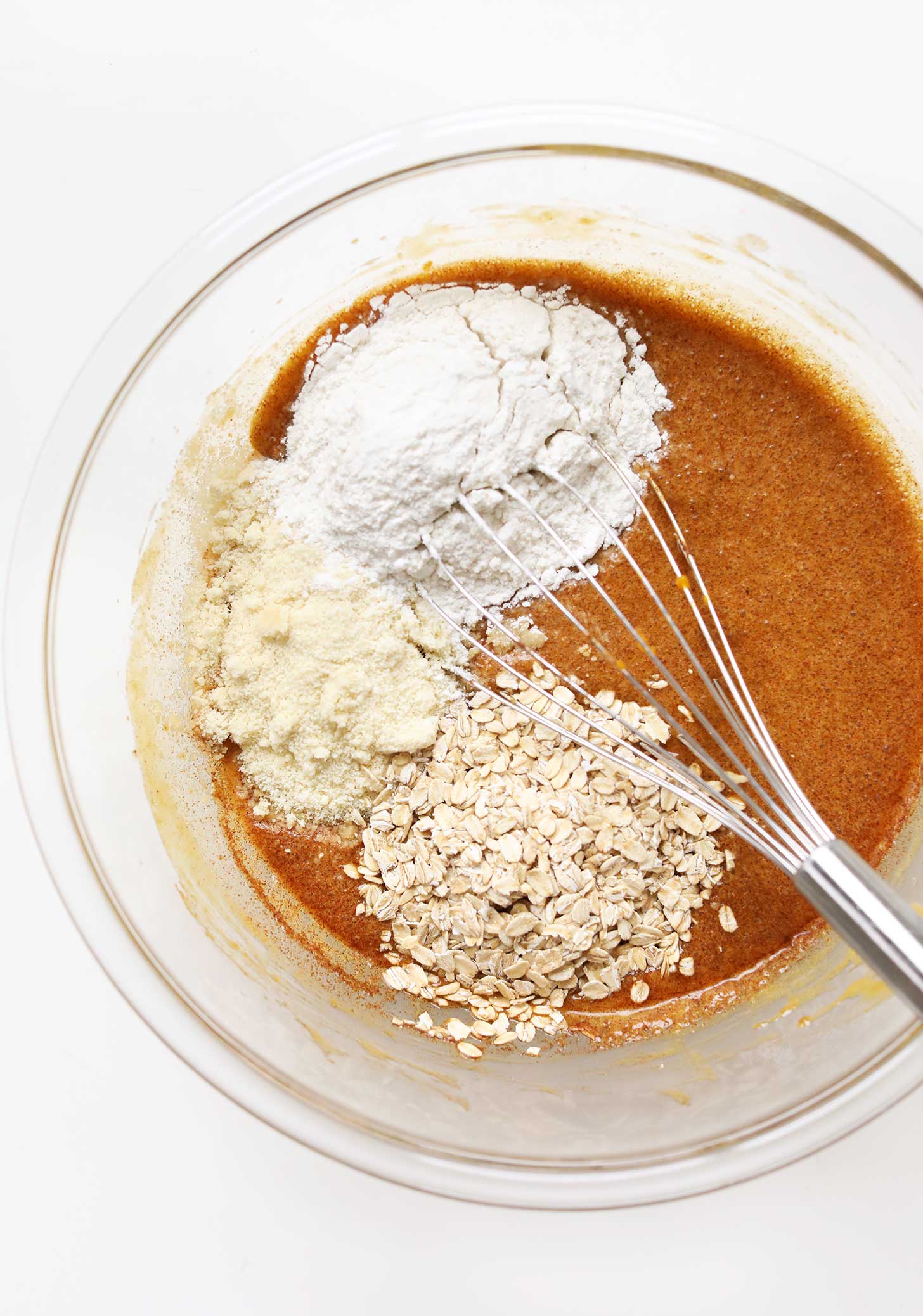 Whisking together wet and dry ingredients for Vegan Gluten-Free Pumpkin Roll