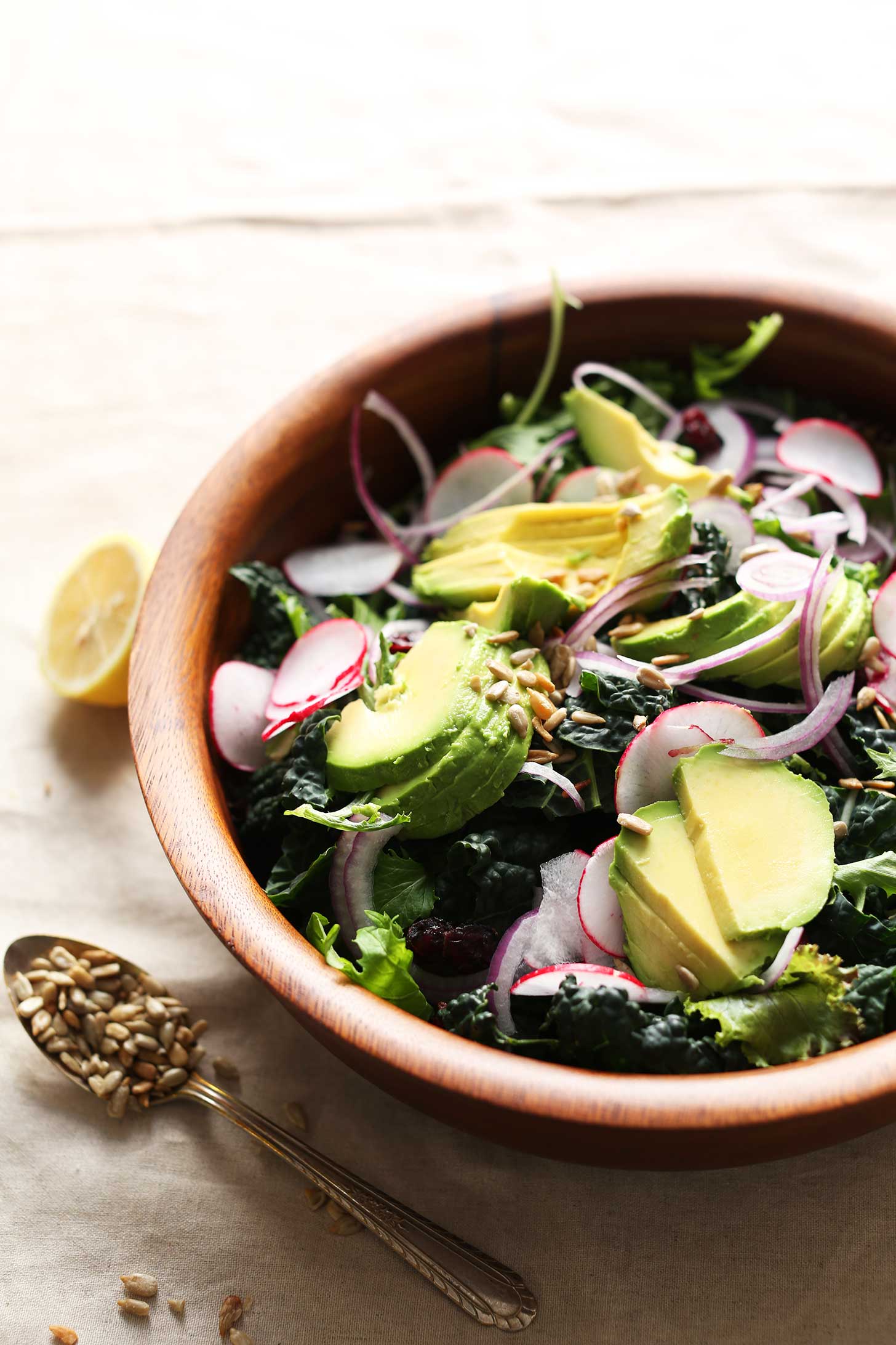 Wood bowl with a big gluten-free vegan detox salad with no-mix dressing